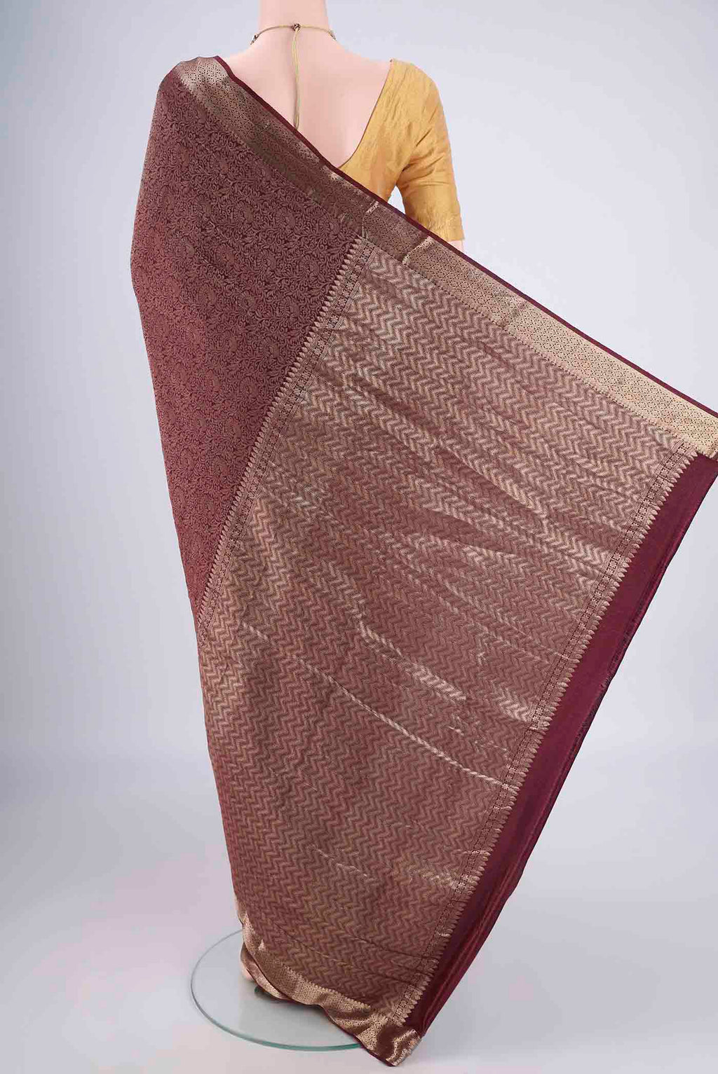 Flat view of Coffee Brown Mysore Crepe Saree with Zari Brocade on the body and Zari Border. 