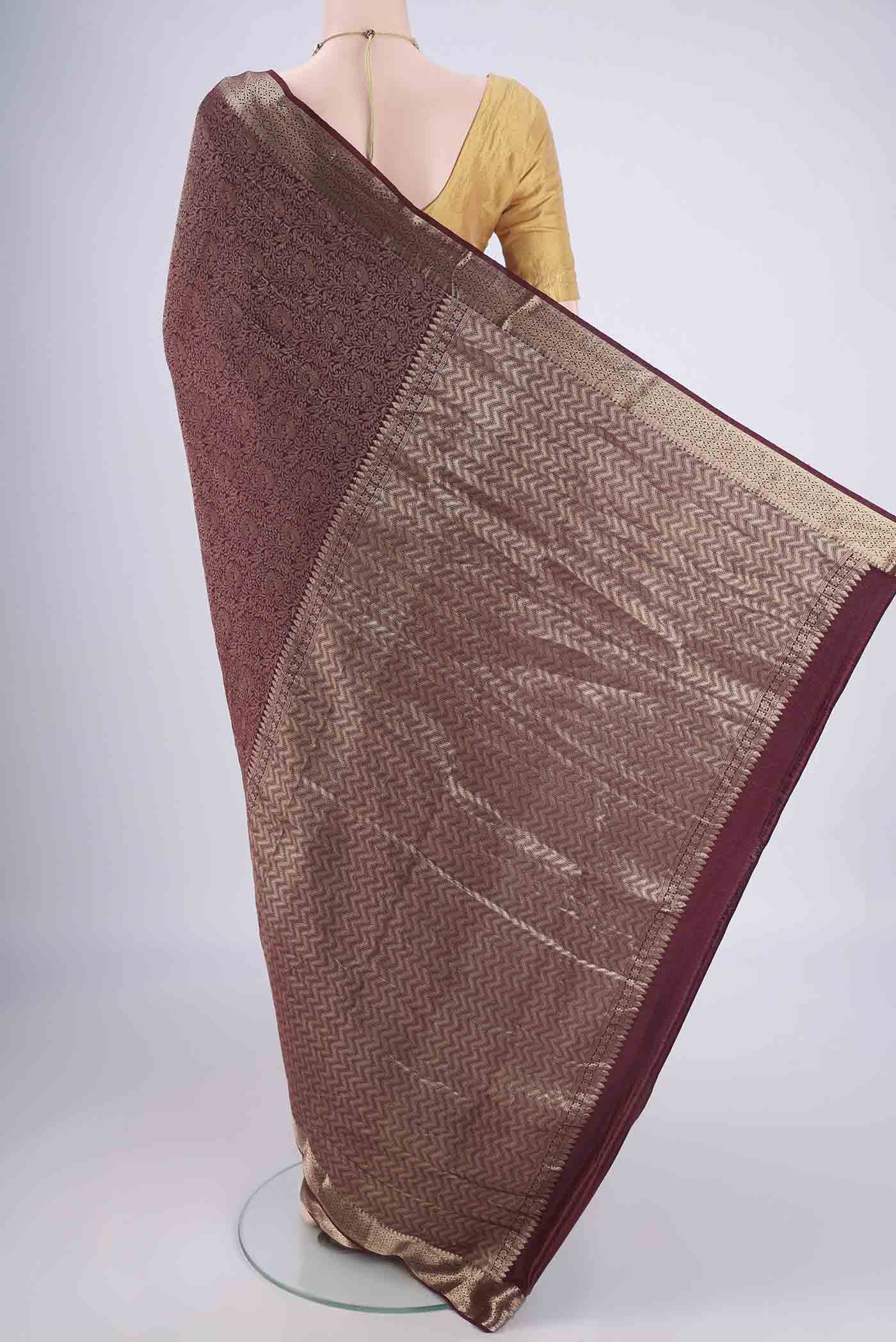 Flat view of Coffee Brown Mysore Crepe Saree with Zari Brocade on the body and Zari Border. 