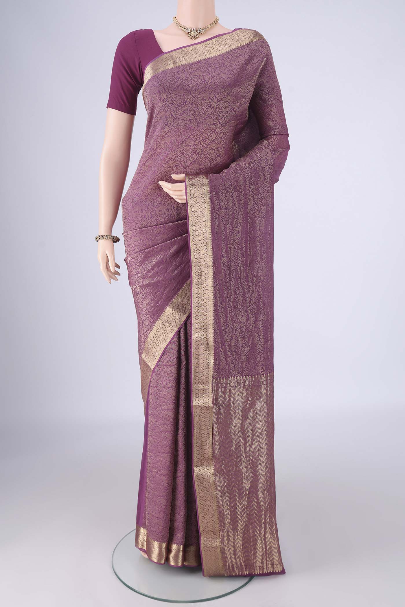 Purple Mysore Crepe Saree with Zari Brocade on the body and Zari Border.  displayed on a mannequin