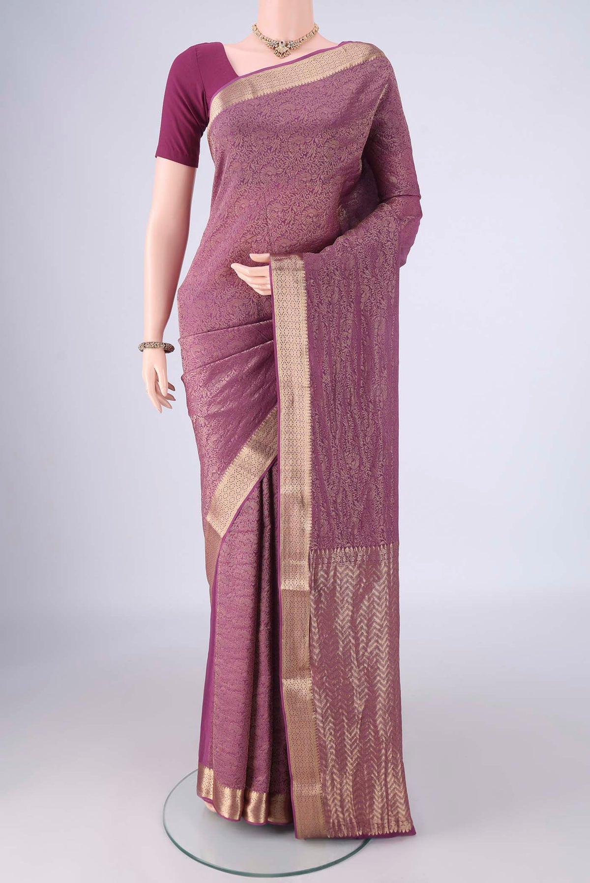 Purple Mysore Crepe Saree with Zari Brocade on the body and Zari Border.  displayed on a mannequin
