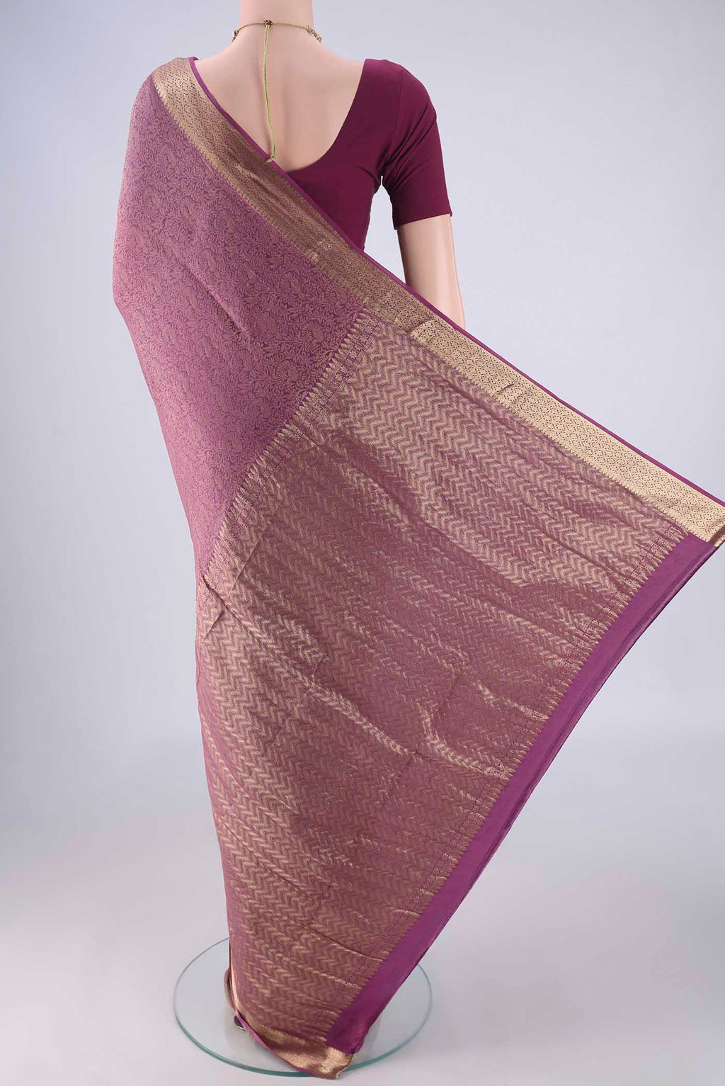 Flat view of Purple Mysore Crepe Saree with Zari Brocade on the body and Zari Border. 