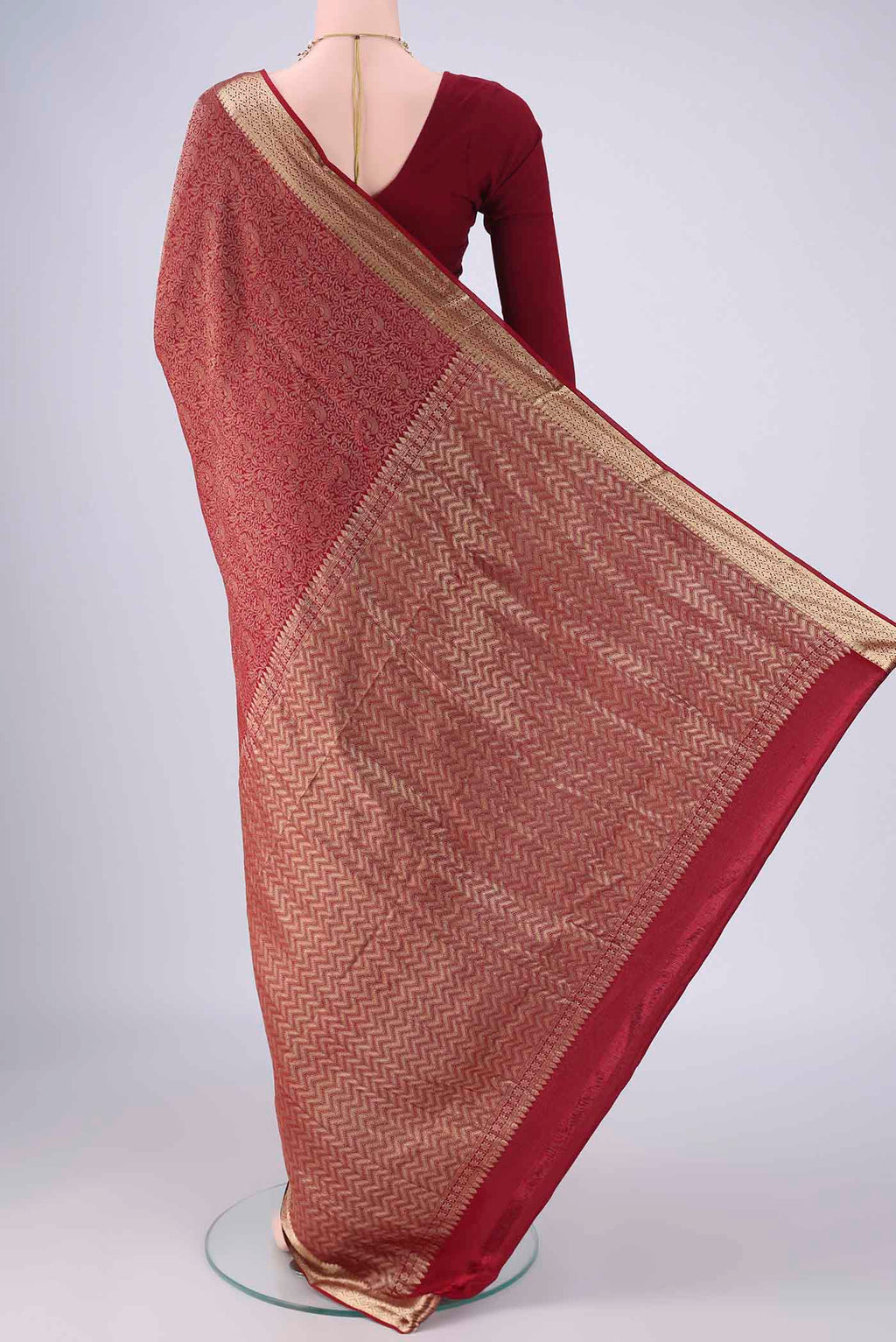 Flat view of Maroon Mysore Crepe Saree with Zari Brocade on the body and Zari Border. 