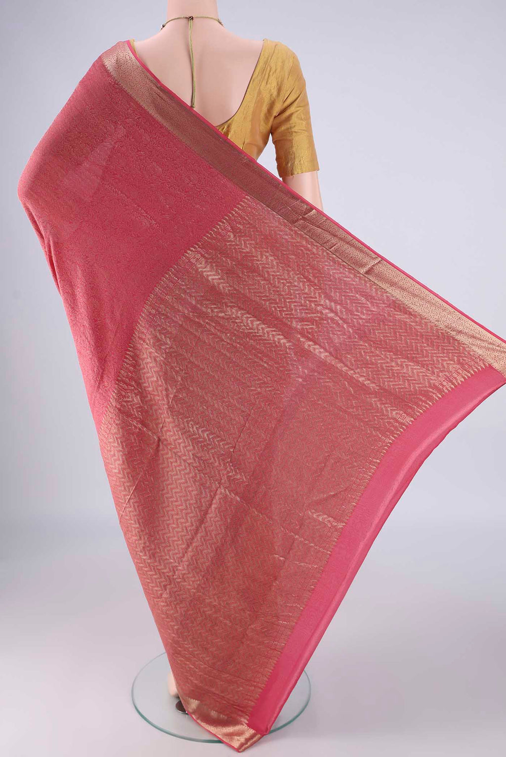 Flat view of Pink Mysore Crepe Saree with Zari Brocade on the body and Zari Border. 