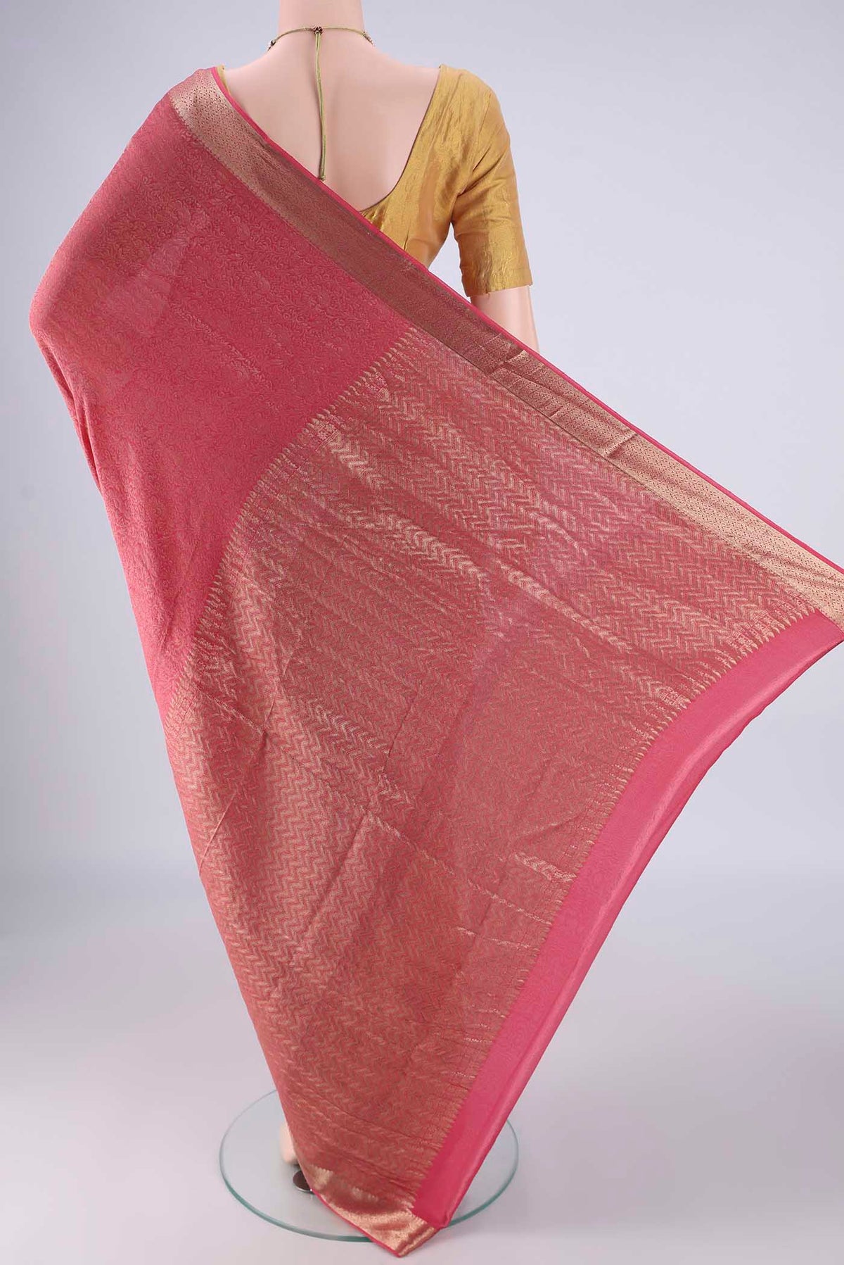 Flat view of Pink Mysore Crepe Saree with Zari Brocade on the body and Zari Border. 
