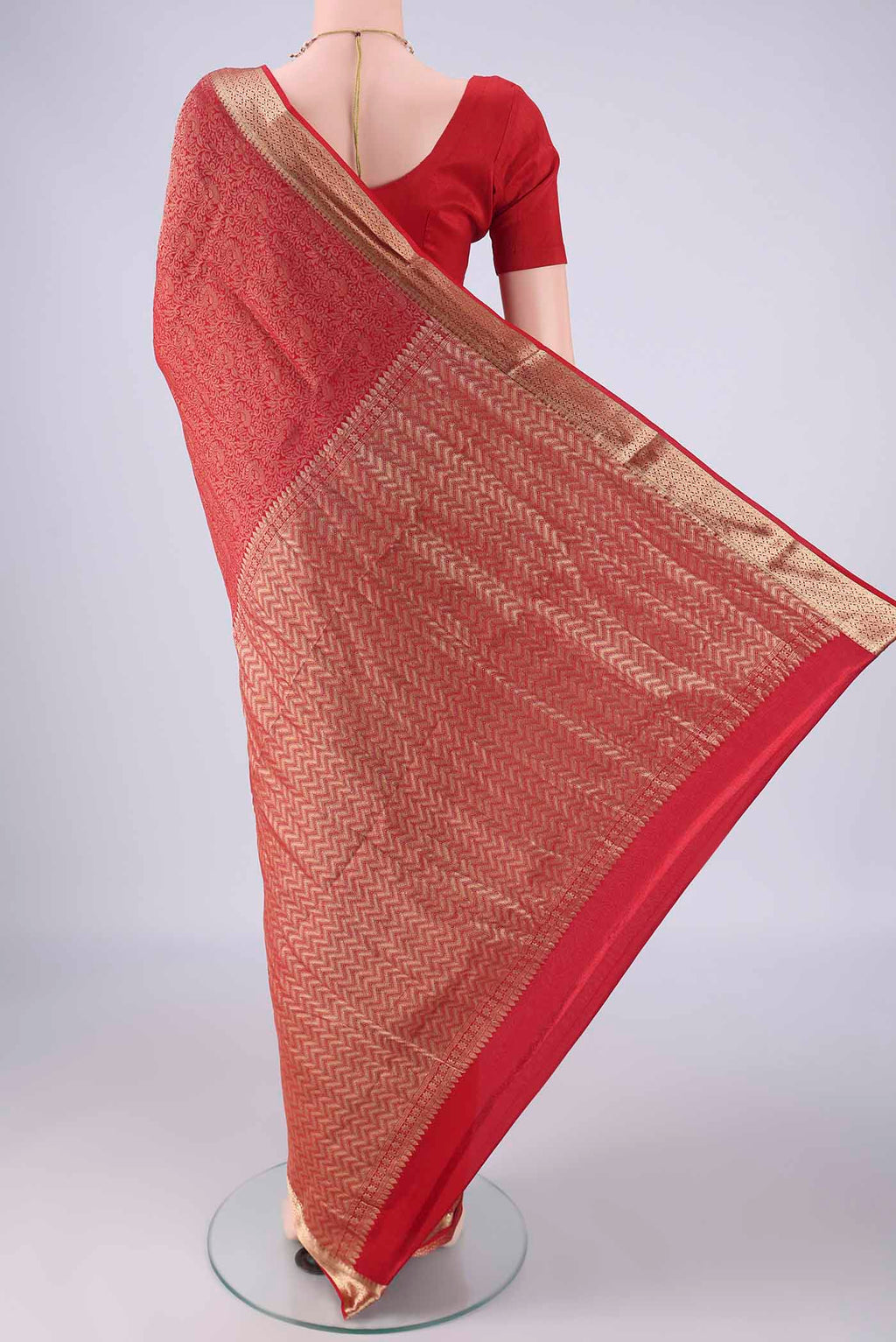 Flat view of Red Mysore Crepe Saree with Zari Brocade on the body and Zari Border. 