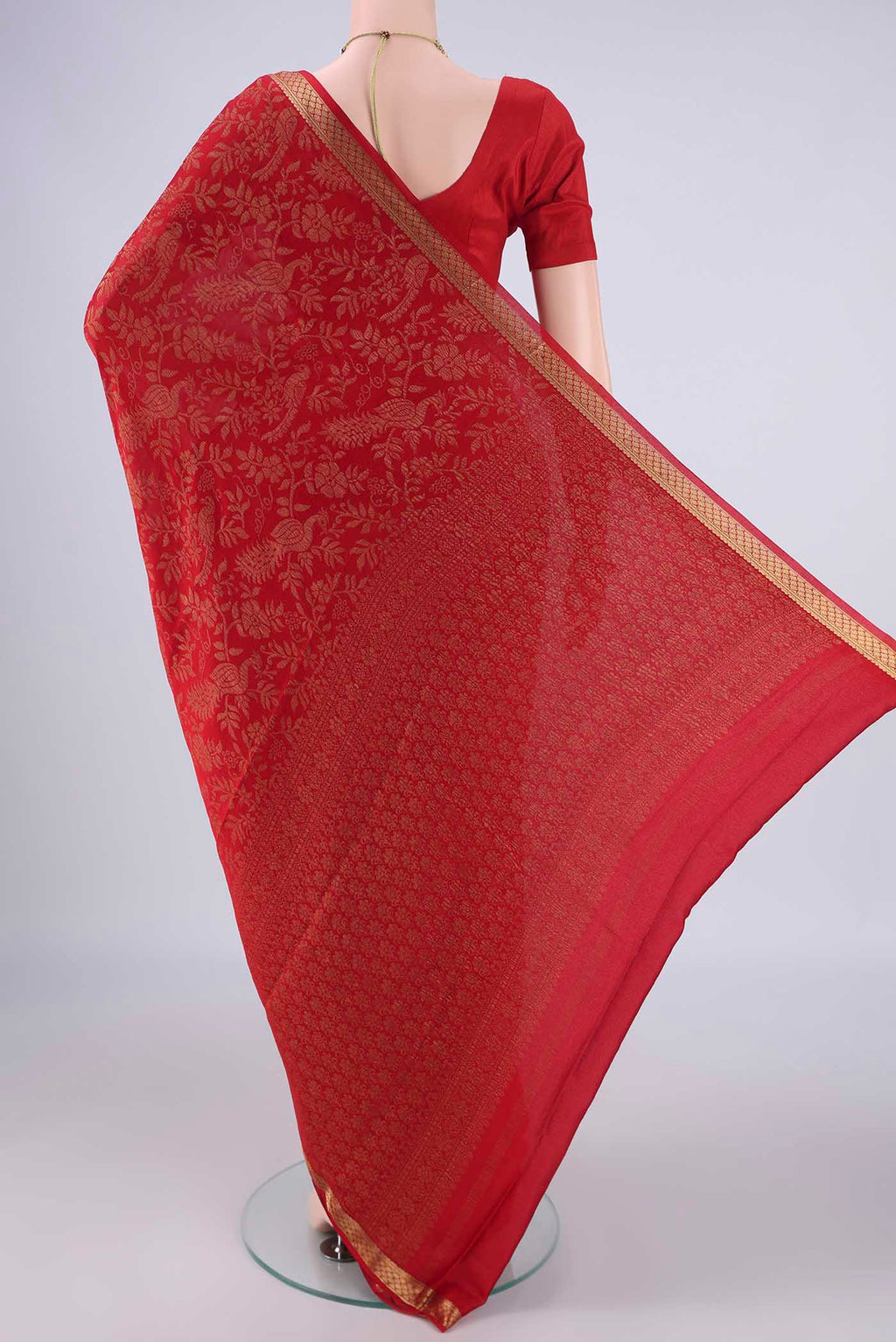 Flat view of Red Mysore Crepe Saree with Zari Brocade on the body and Zari Border. 