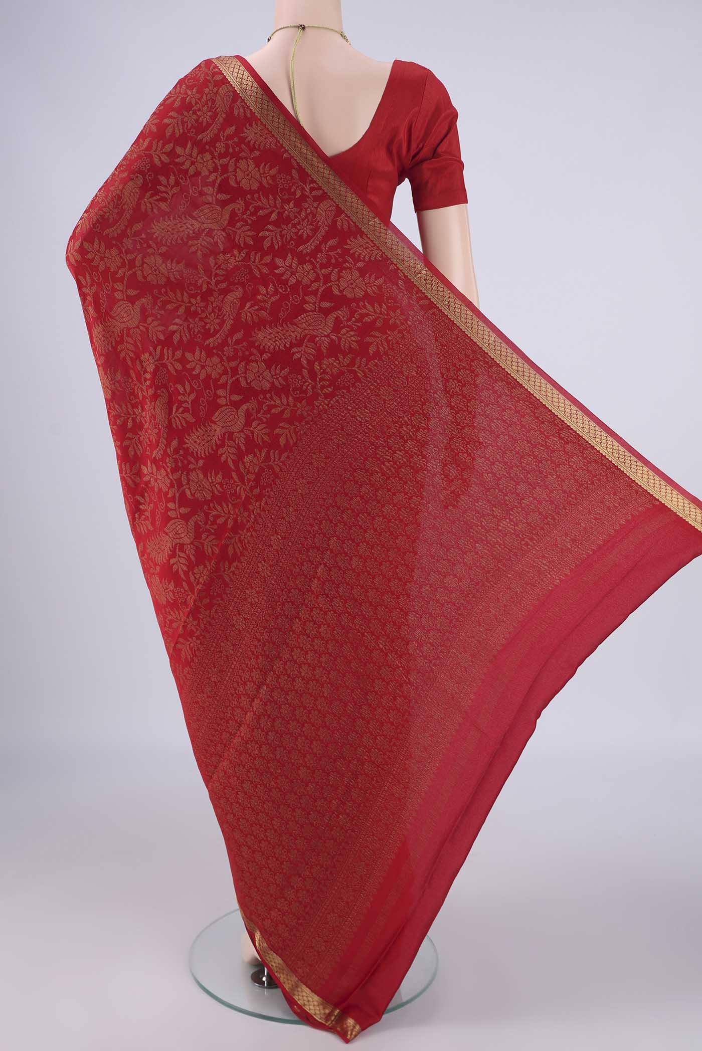 Flat view of Red Mysore Crepe Saree with Zari Brocade on the body and Zari Border. 