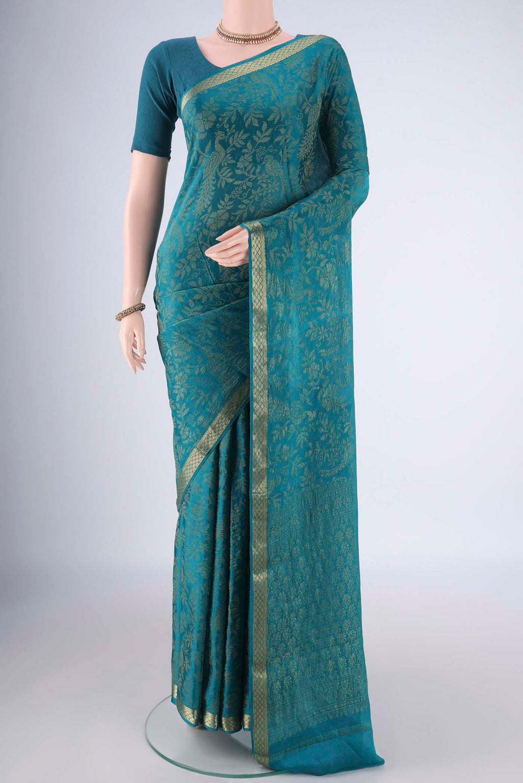 Teal Mysore Georgette Saree with Zari Brocade on the body and Zari Border.  displayed on a mannequin