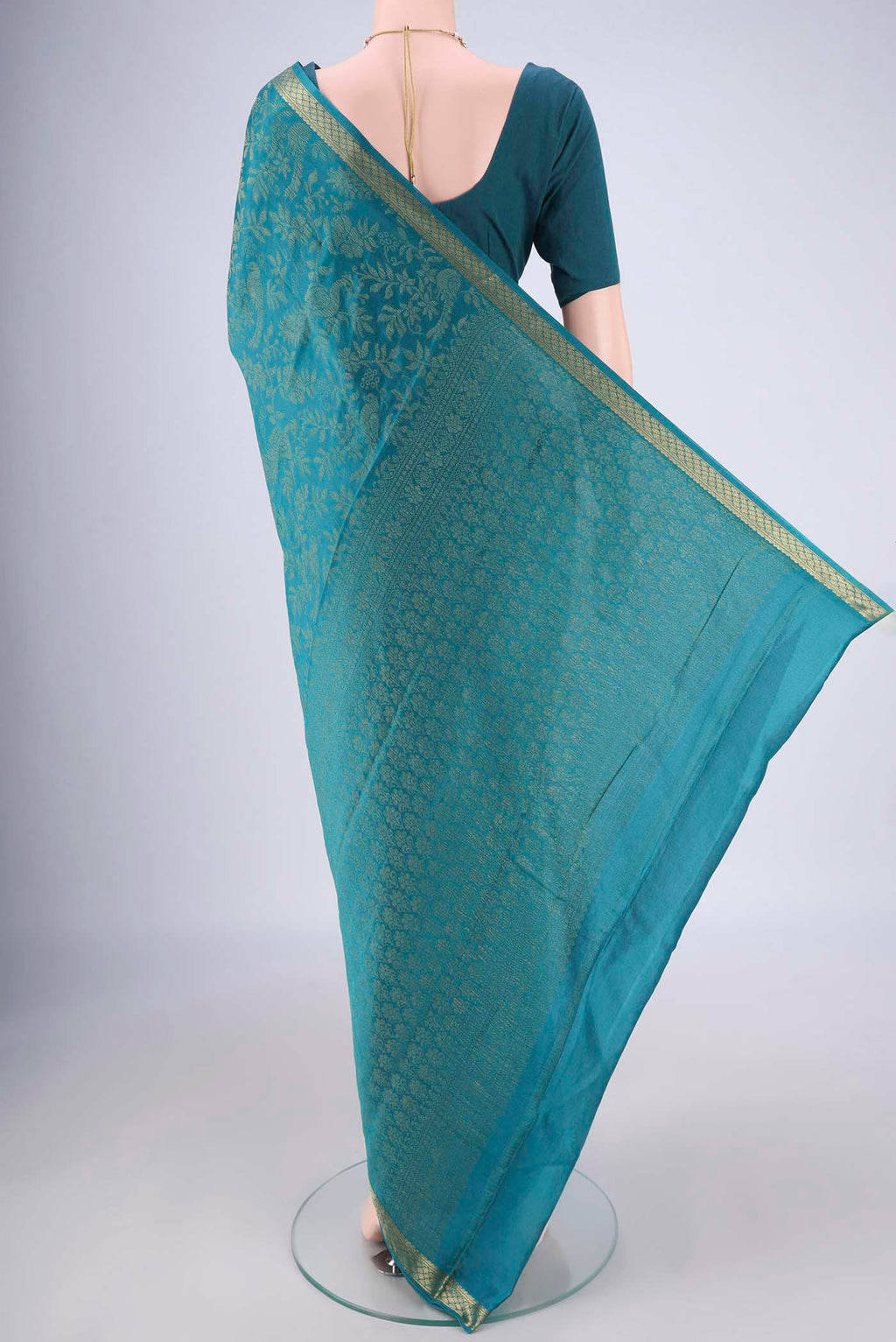 Flat view of Teal Mysore Georgette Saree with Zari Brocade on the body and Zari Border. 