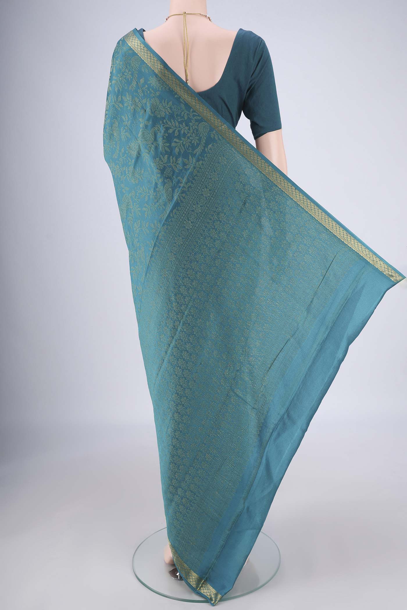 Flat view of Teal Mysore Georgette Saree with Zari Brocade on the body and Zari Border. 