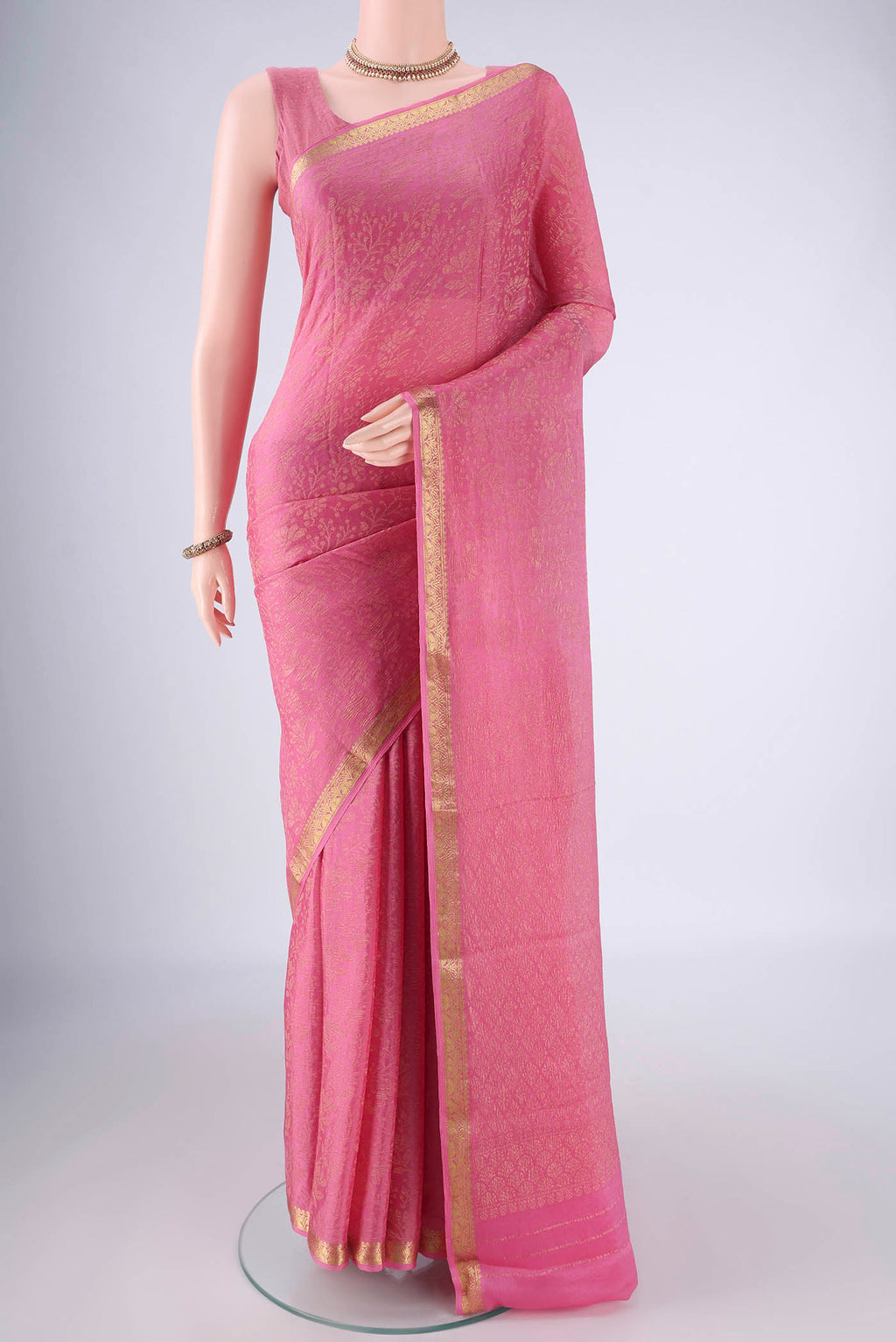 Rose pink Mysore Georgette Saree with Zari Brocade on the body and Zari Border.  displayed on a mannequin