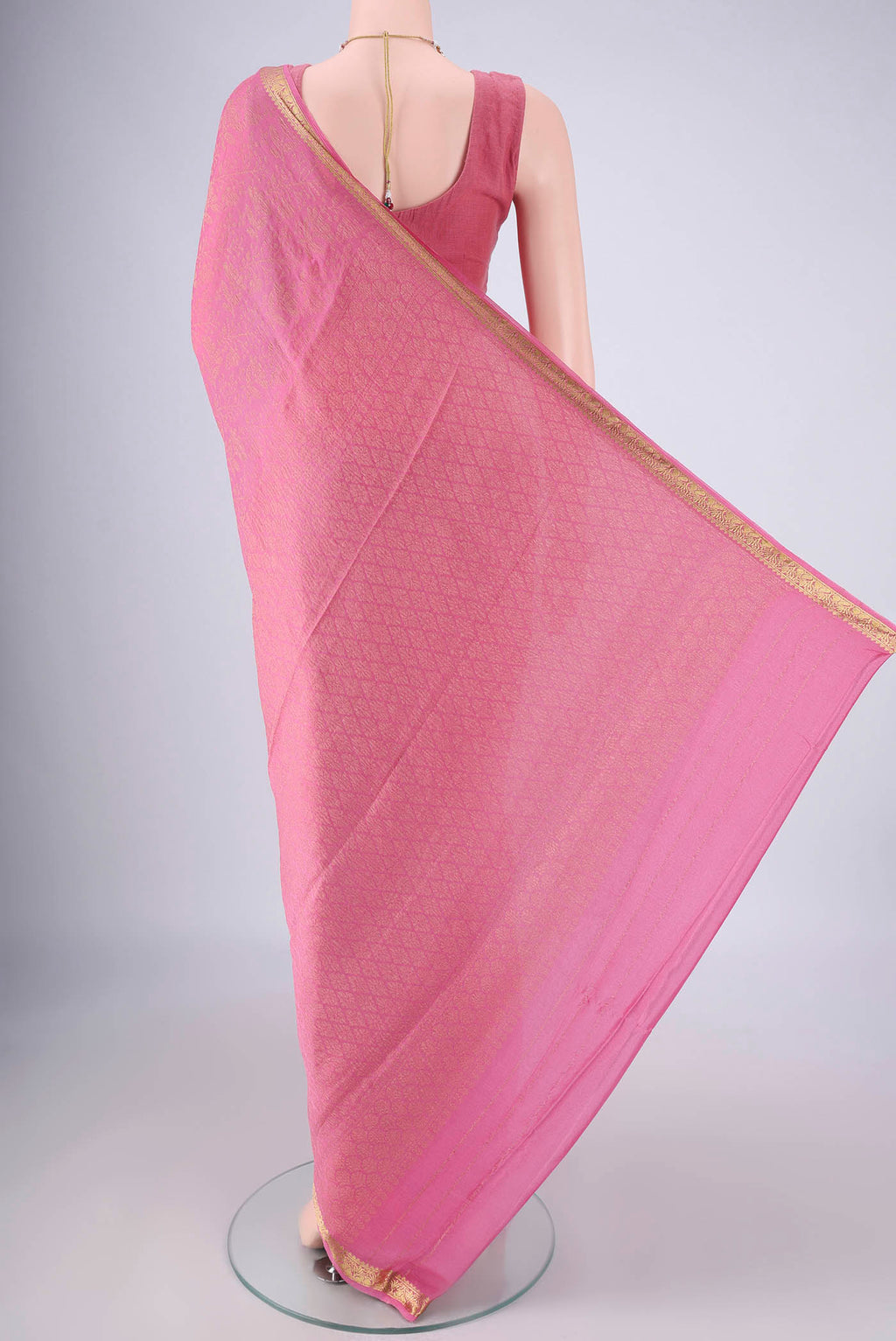 Flat view of Rose pink Mysore Georgette Saree with Zari Brocade on the body and Zari Border. 