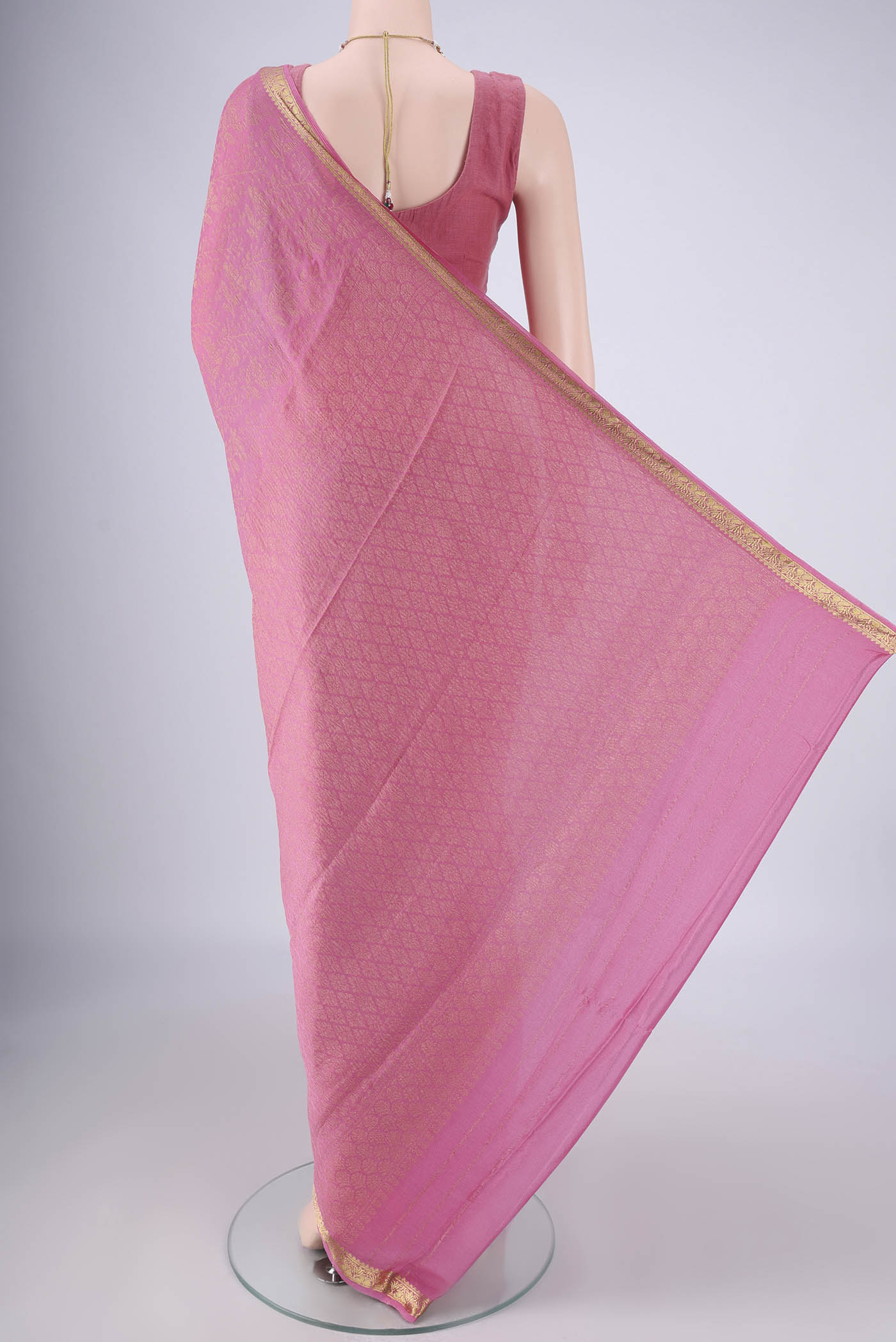 Flat view of Rose pink Mysore Georgette Saree with Zari Brocade on the body and Zari Border. 