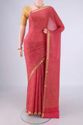 Coral Mysore Crepe Saree with Zari Brocade on the body and Zari Border.  displayed on a mannequin
