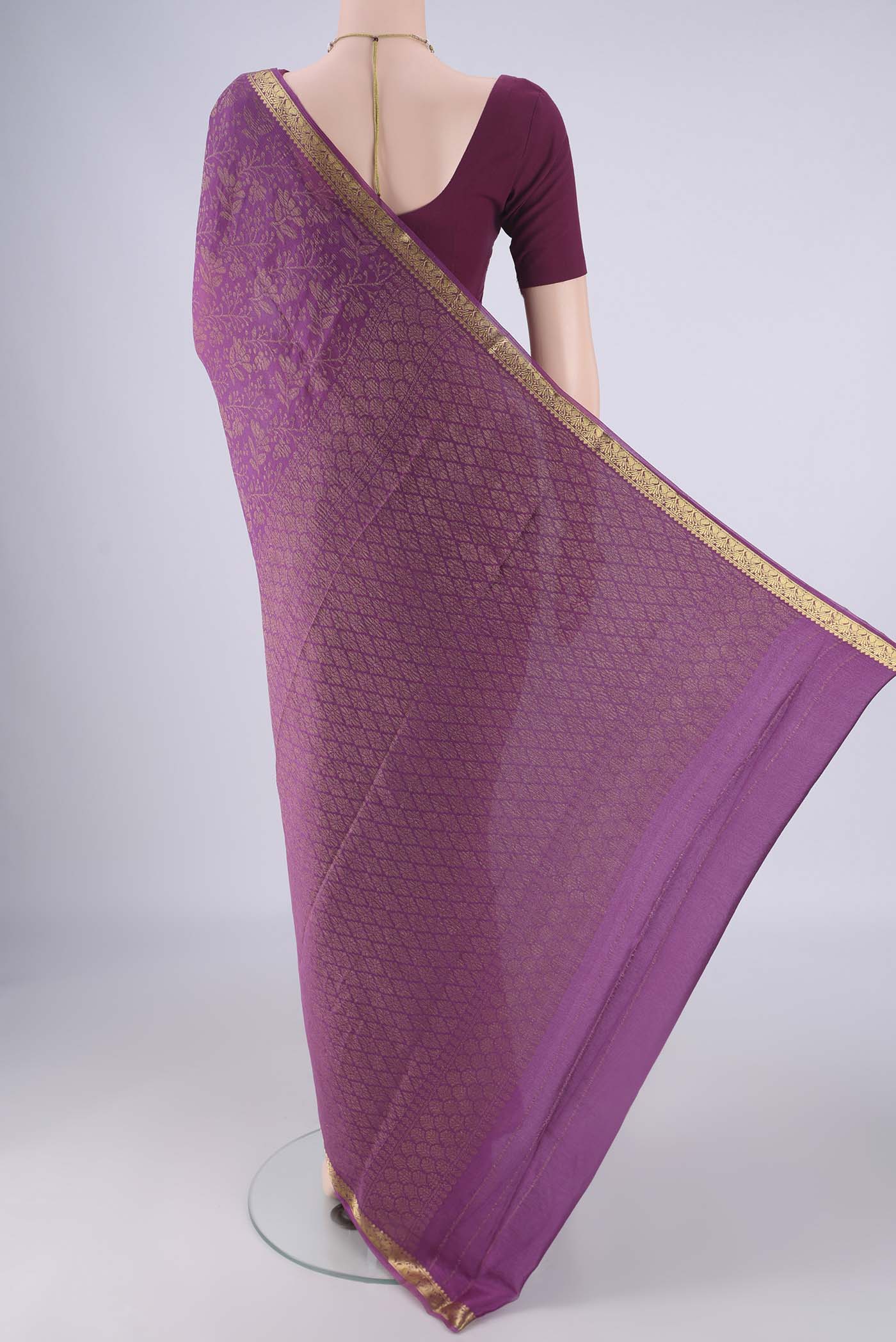 Flat view of Purple Mysore Crepe Saree with Zari Brocade on the body and Zari Border. 