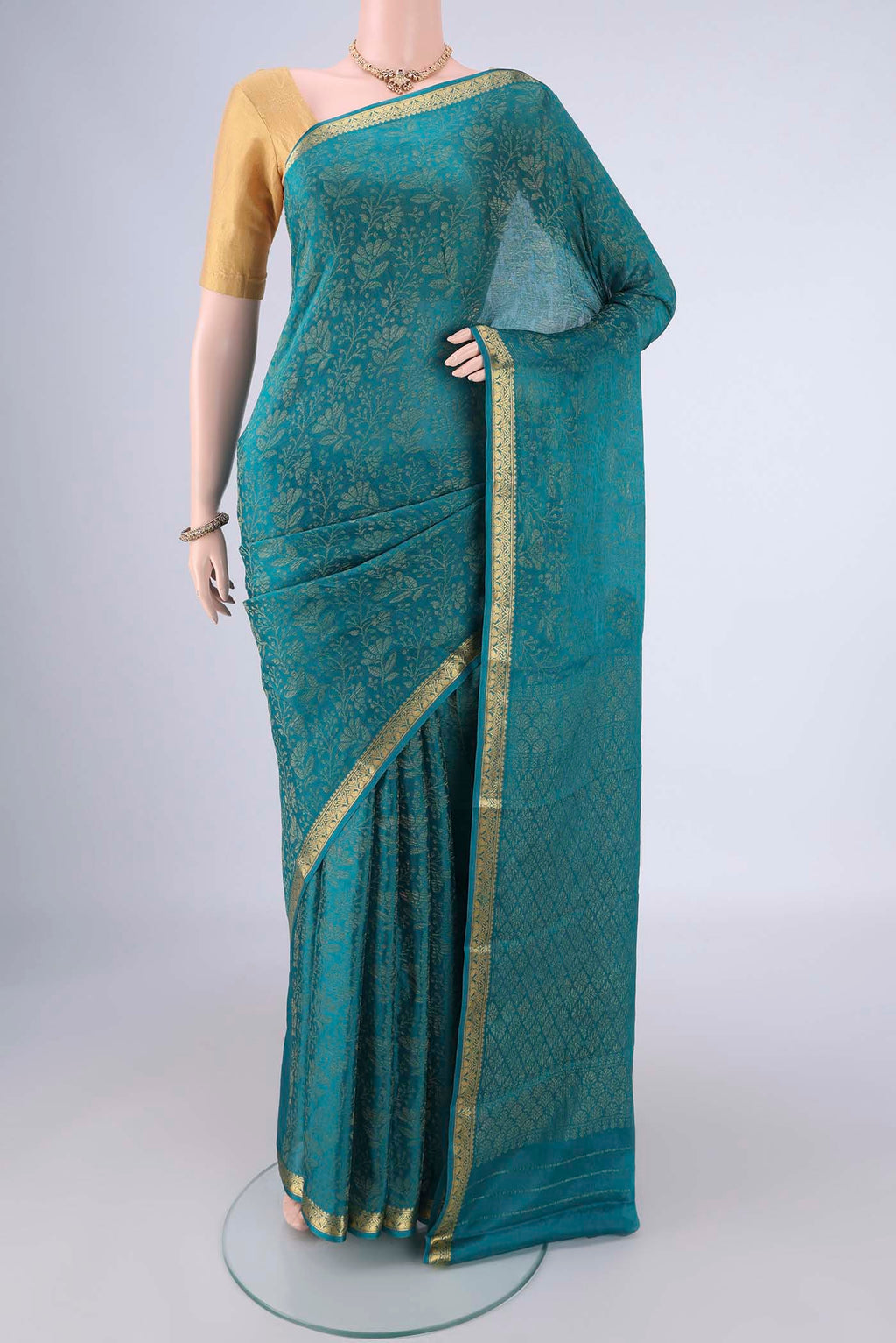 Blue Mysore Crepe Saree with Zari Brocade on the body and Zari Border.  displayed on a mannequin