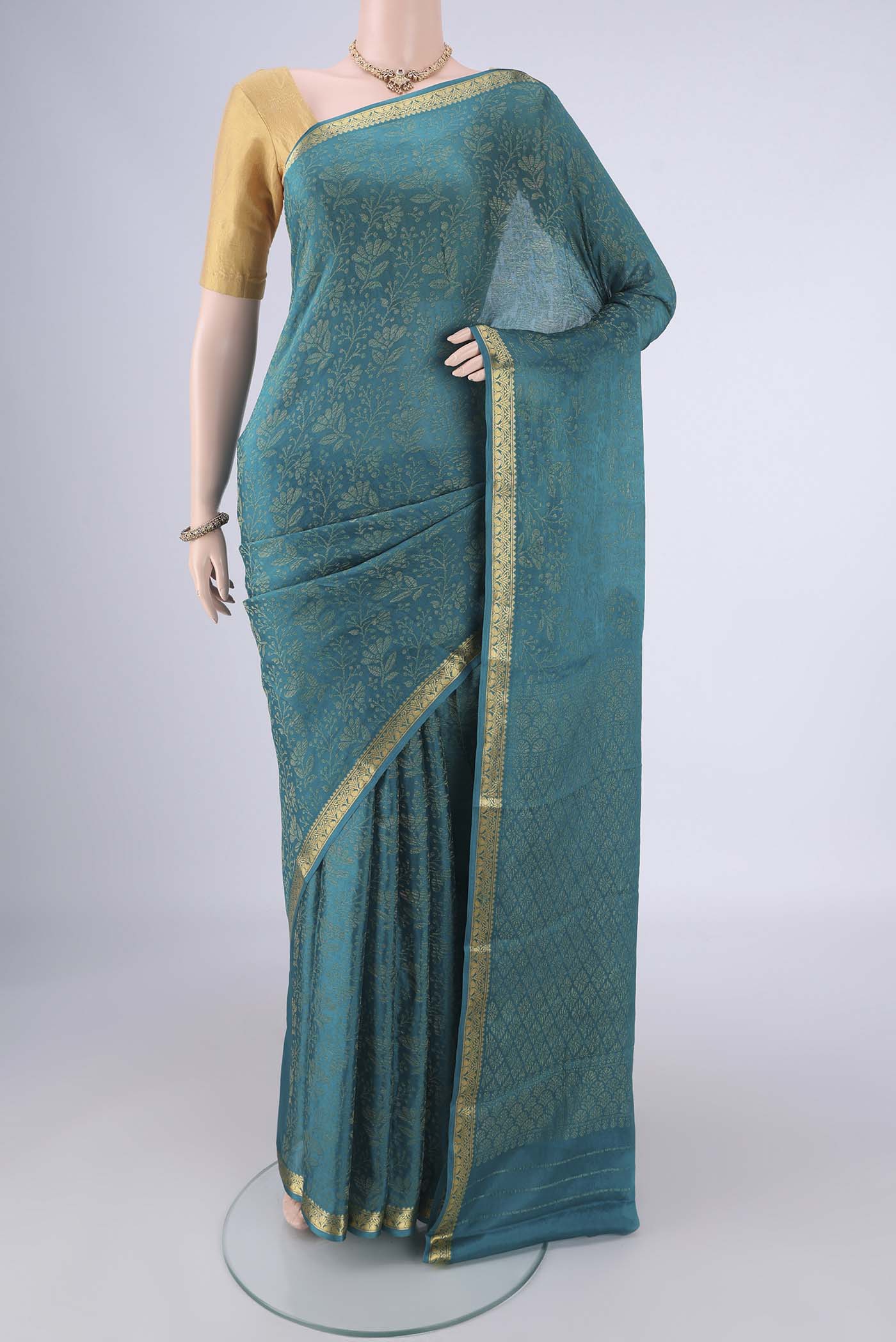 Blue Mysore Crepe Saree with Zari Brocade on the body and Zari Border.  displayed on a mannequin