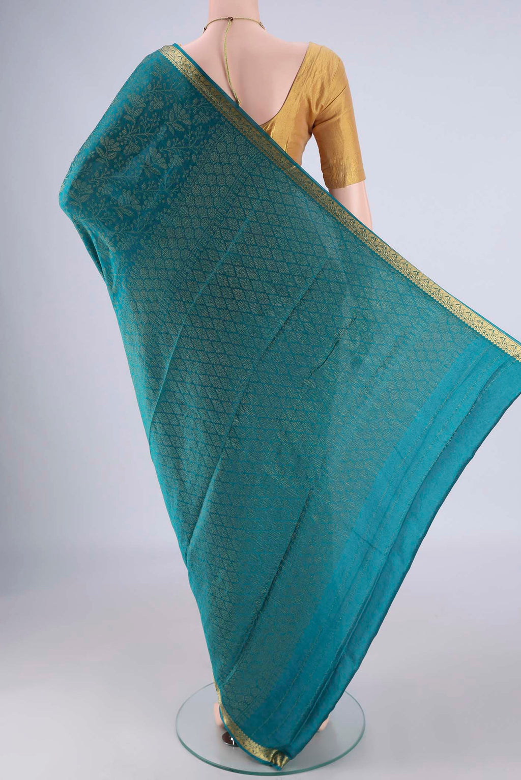Flat view of Blue Mysore Crepe Saree with Zari Brocade on the body and Zari Border. 