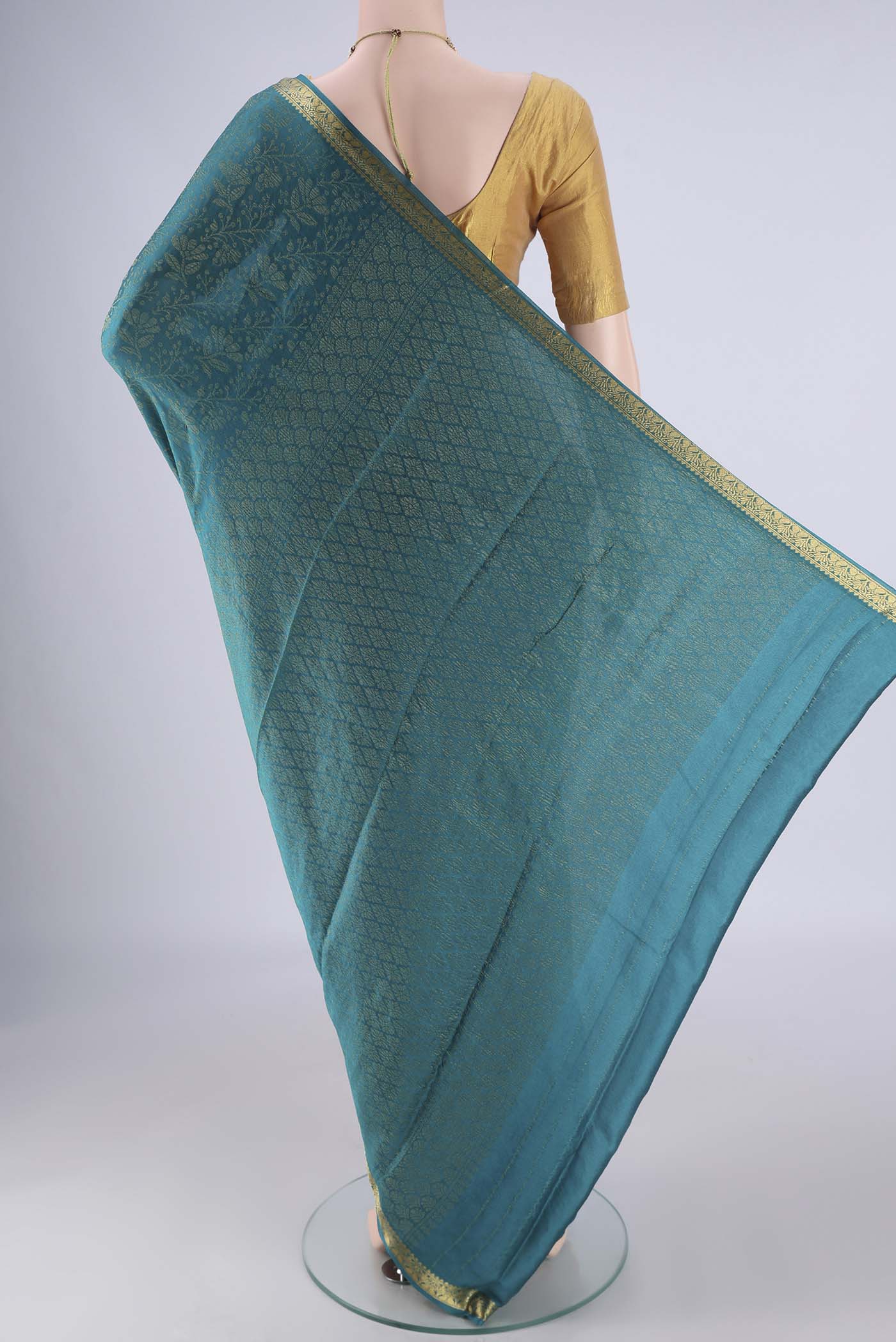 Flat view of Blue Mysore Crepe Saree with Zari Brocade on the body and Zari Border. 