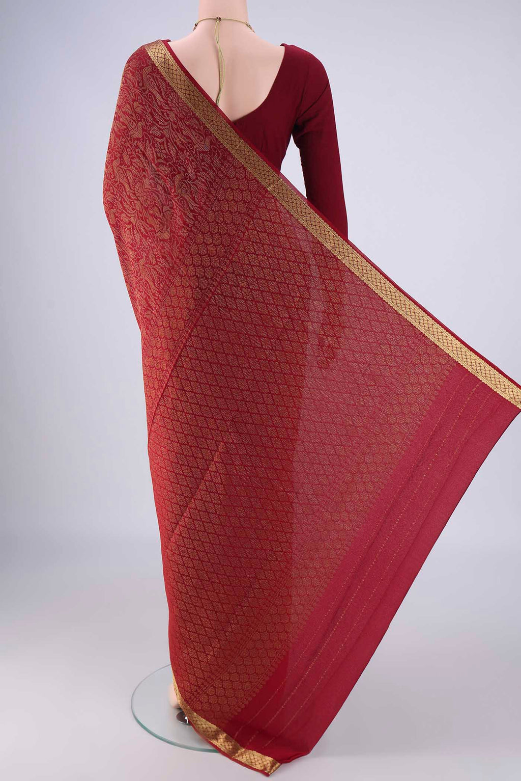 Flat view of Maroon Mysore Crepe Saree with Zari Brocade on the body and Zari Border. 