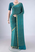 Teal Mysore Crepe Saree with Zari Brocade on the body and Zari Border.  displayed on a mannequin