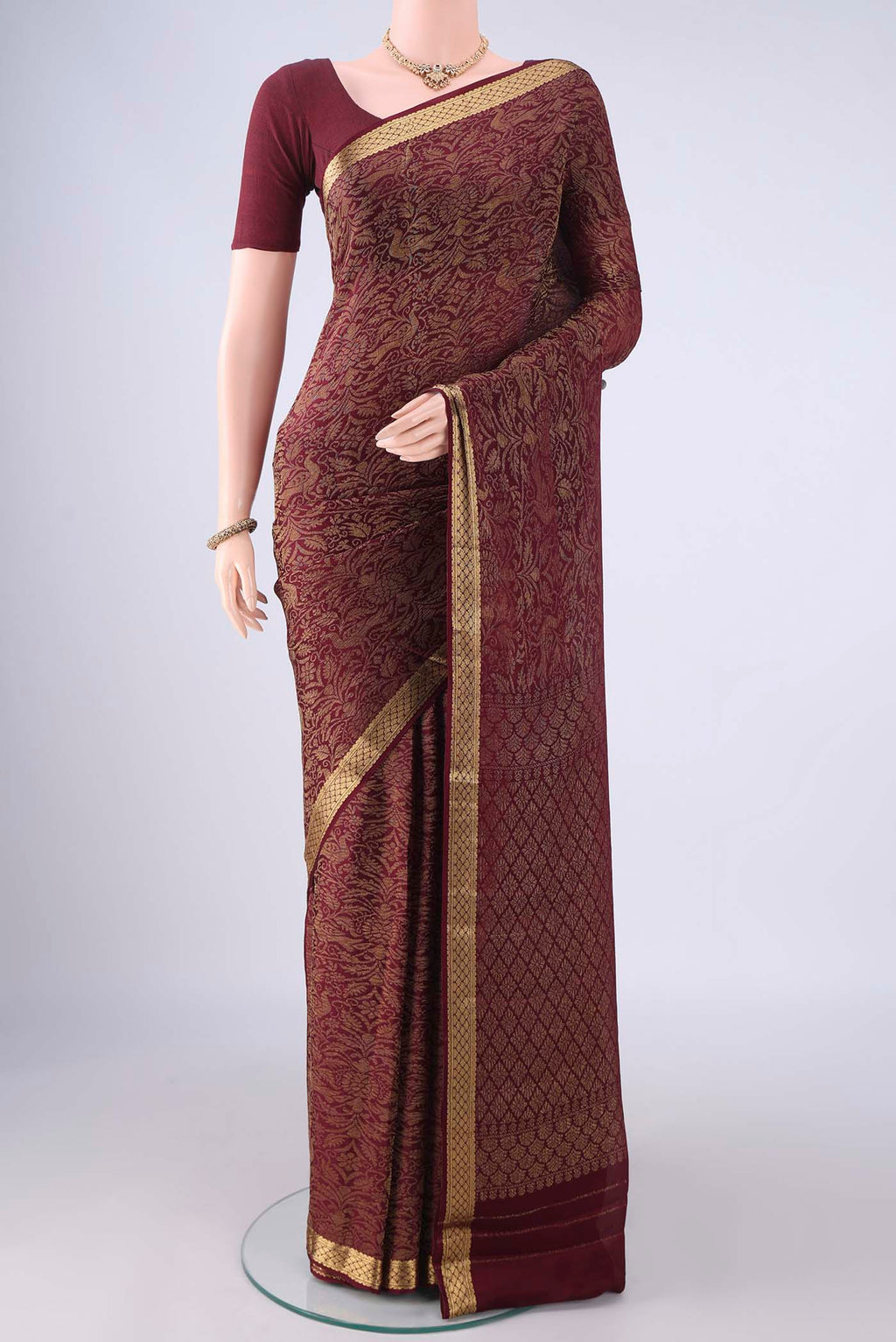 Coffee Brown Mysore Crepe Saree with Zari Brocade on the body and Zari Border.  displayed on a mannequin