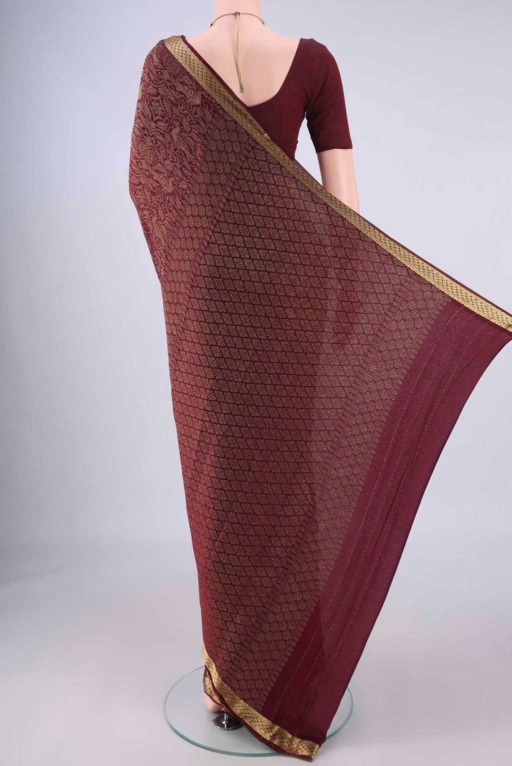 Flat view of Coffee Brown Mysore Crepe Saree with Zari Brocade on the body and Zari Border. 