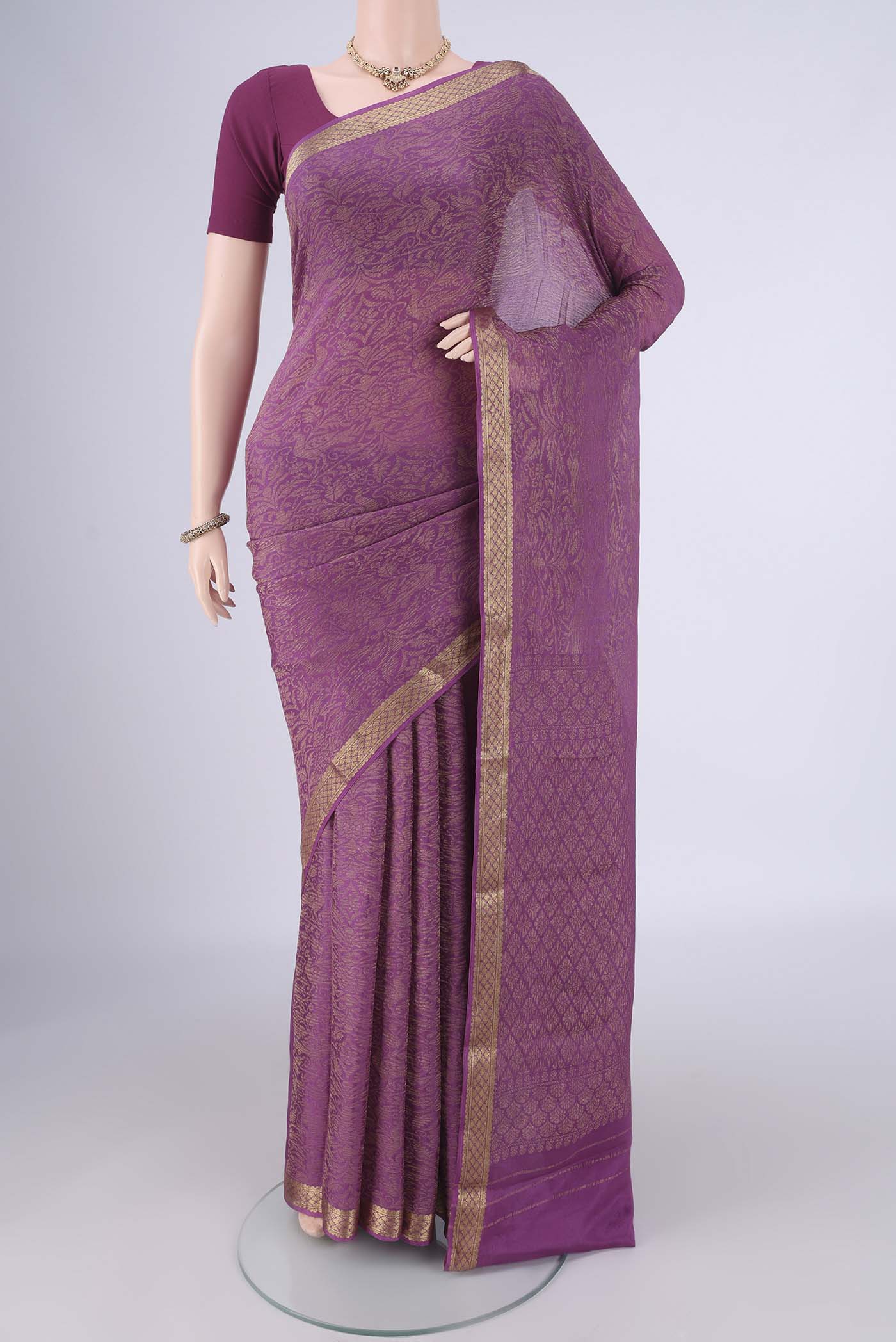 Purple Mysore Crepe Saree with Zari Brocade on the body and Zari Border.  displayed on a mannequin