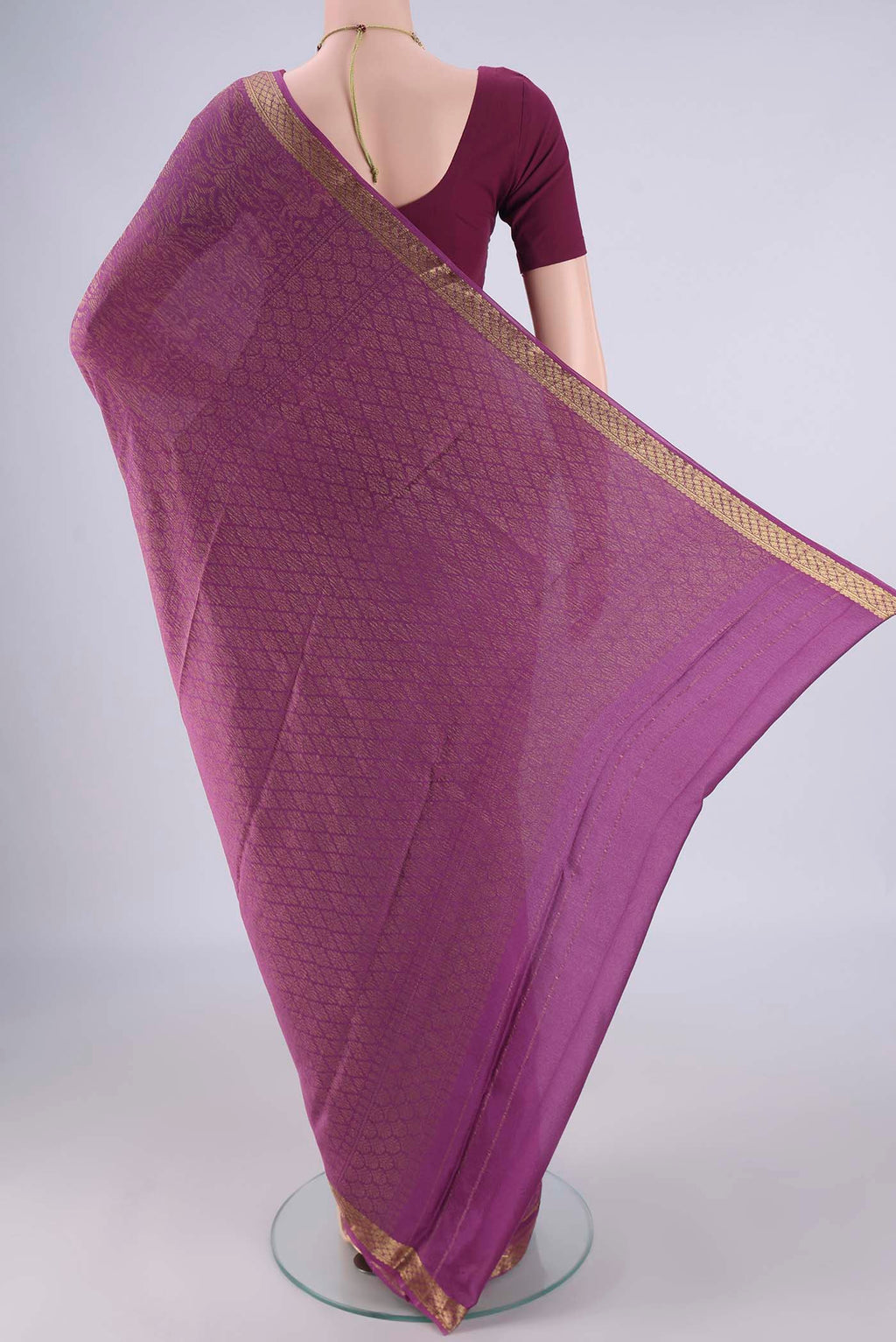 Flat view of Purple Mysore Crepe Saree with Zari Brocade on the body and Zari Border. 