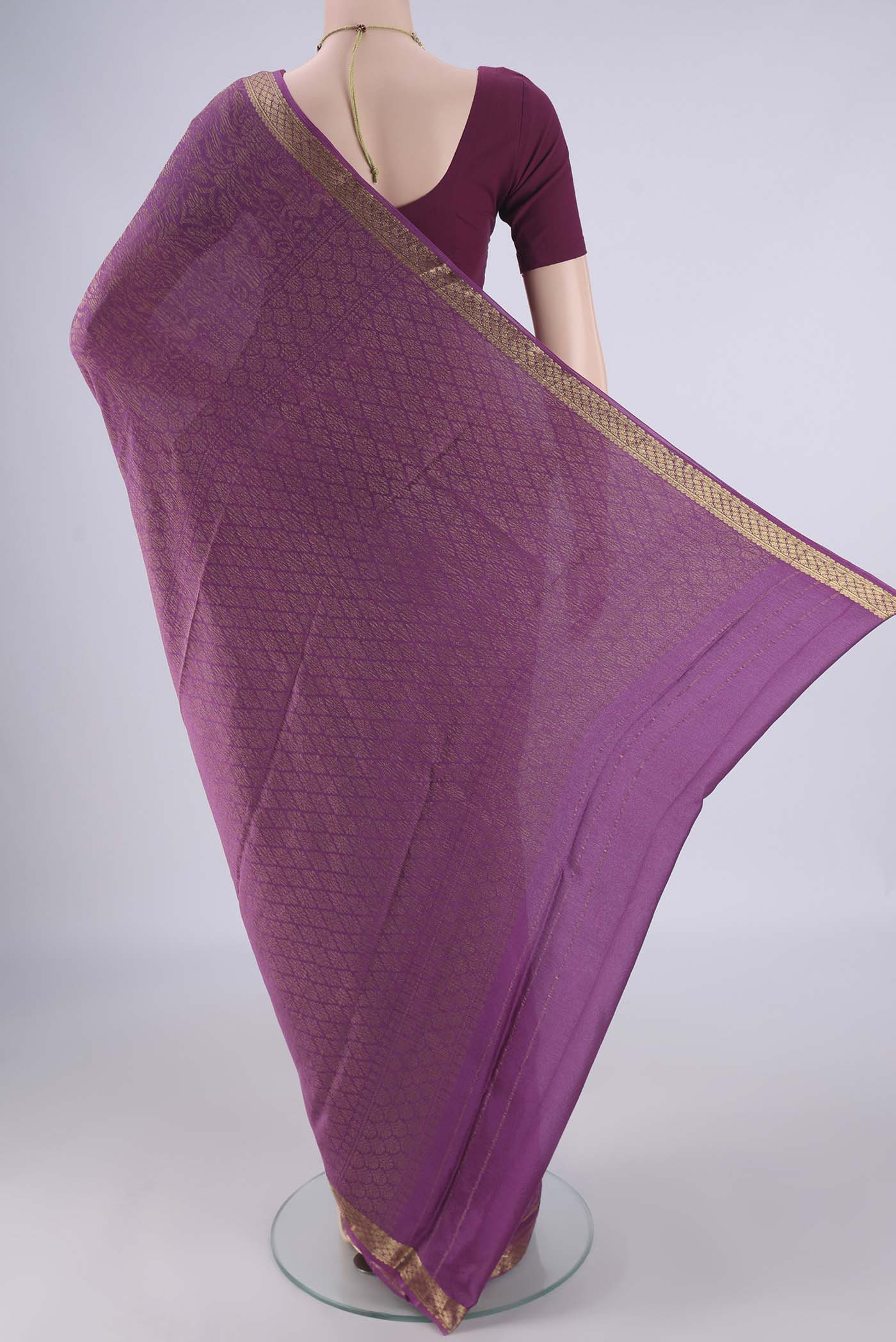 Flat view of Purple Mysore Crepe Saree with Zari Brocade on the body and Zari Border. 