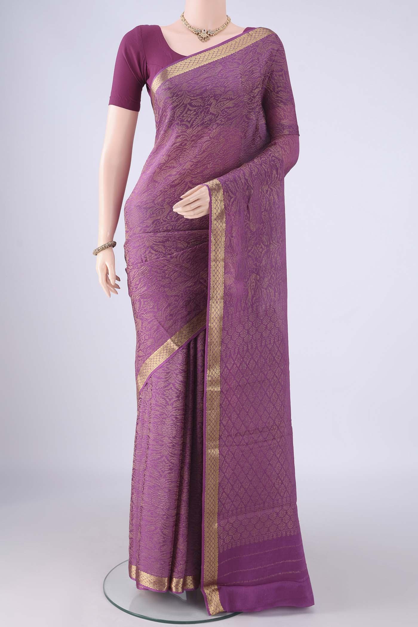 Purple Mysore Crepe Saree with Zari Brocade on the body and Zari Border.  displayed on a mannequin
