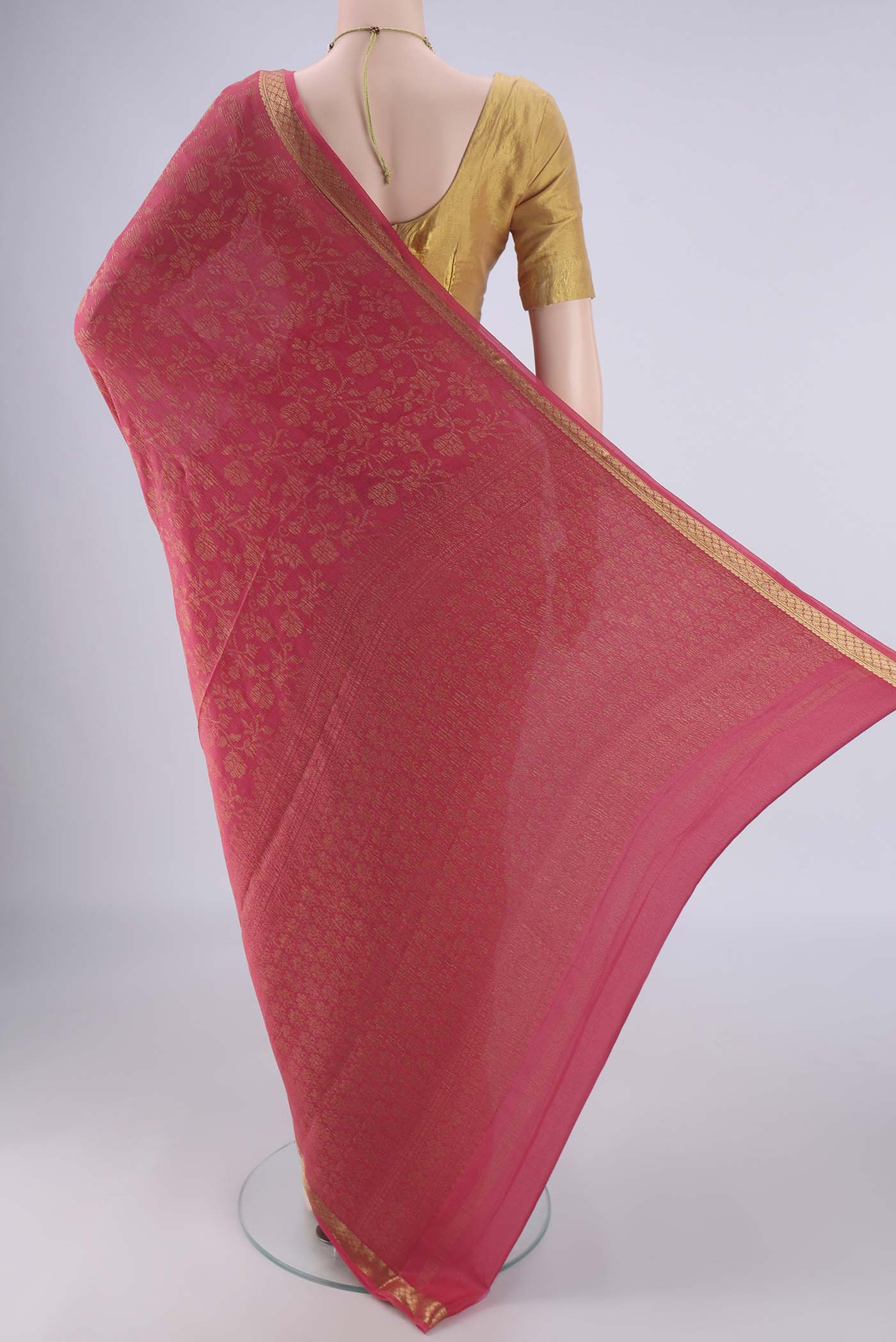 Flat view of Peach Mysore Crepe Saree with Zari Brocade on the body and Zari Border. 