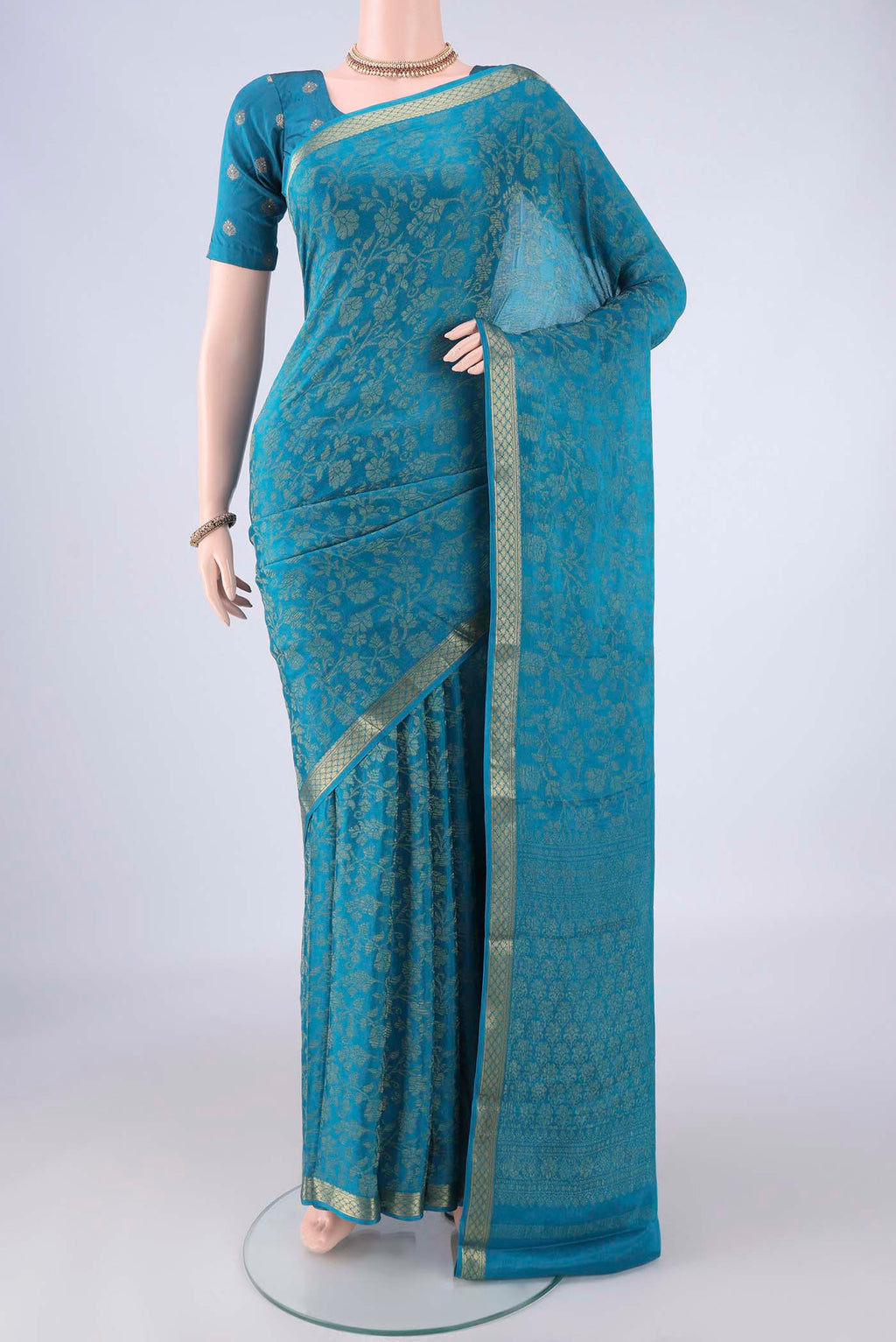Blue Mysore Crepe Saree with Zari Brocade on the body and Zari Border.  displayed on a mannequin