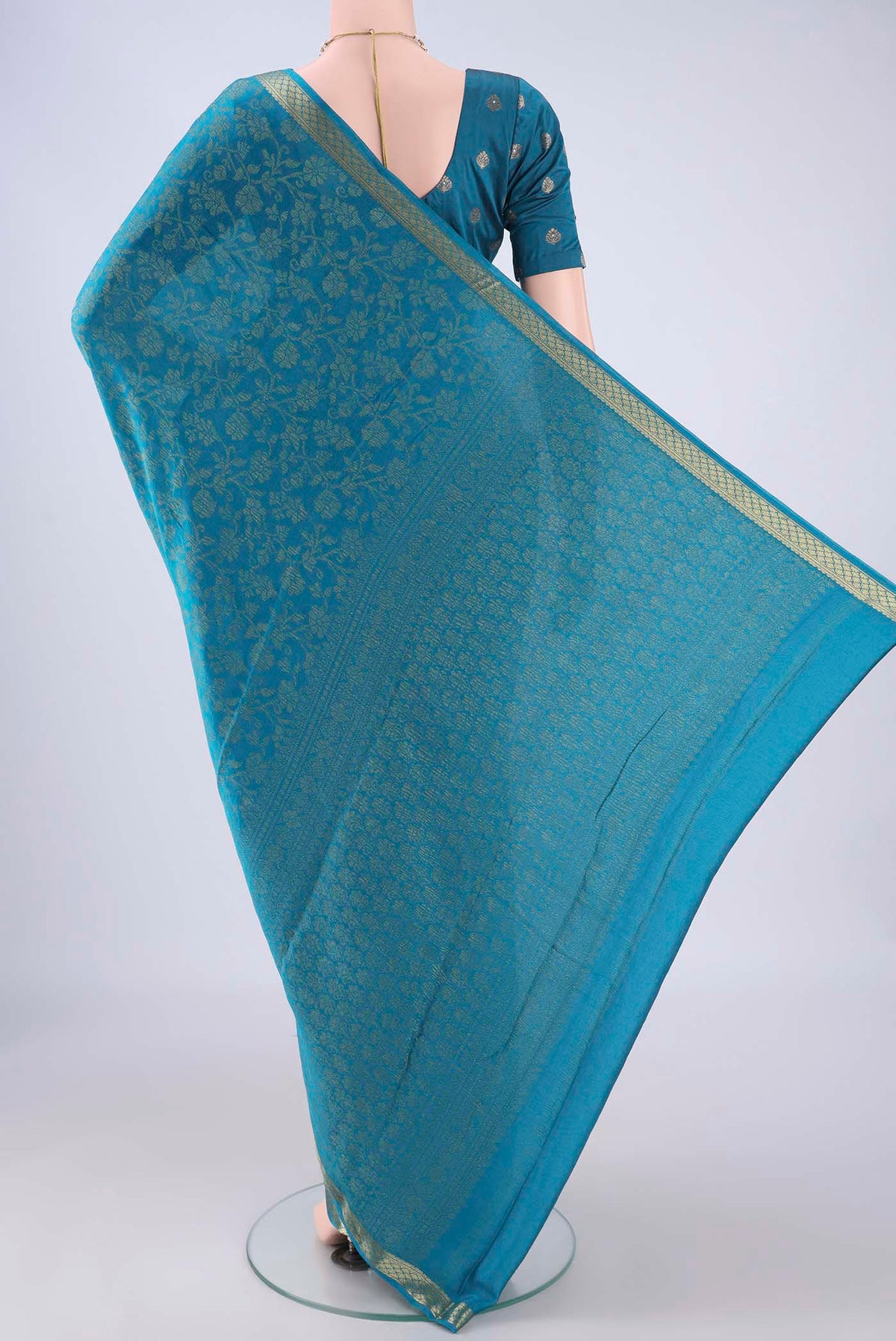 Flat view of Blue Mysore Crepe Saree with Zari Brocade on the body and Zari Border. 