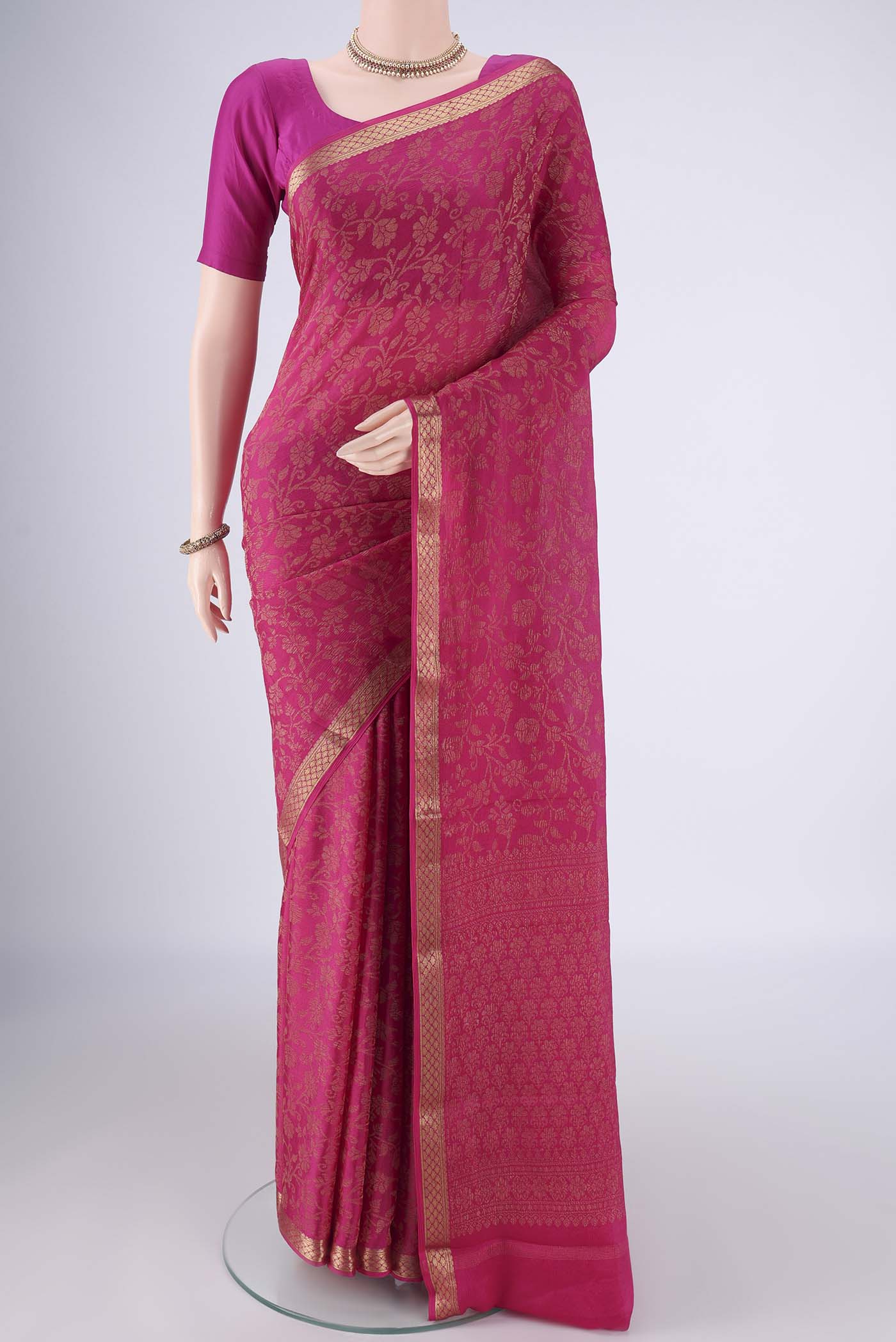 Rani Pink Mysore Georgette Saree with Zari Brocade on the body and Zari Border.  displayed on a mannequin