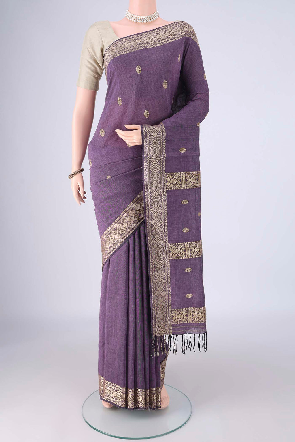 Lilac Assam Cotton Saree with Thread Butta on the body and Thread Border.  displayed on a mannequin
