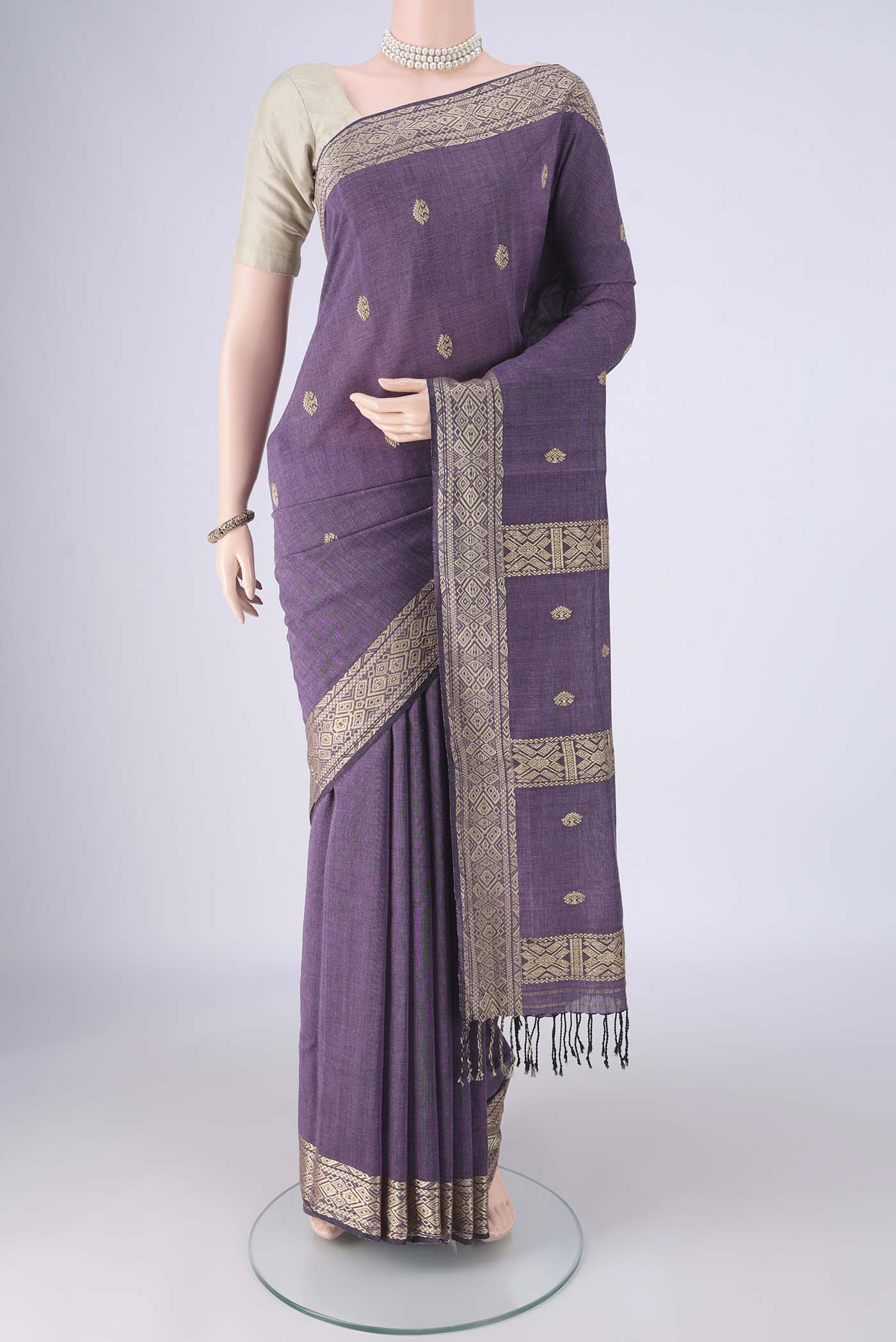Lilac Assam Cotton Saree with Thread Butta on the body and Thread Border.  displayed on a mannequin