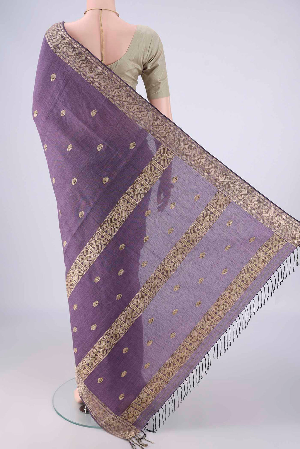 Flat view of Lilac Assam Cotton Saree with Thread Butta on the body and Thread Border. 