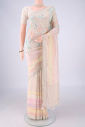 Beige Linen Saree with Embroidery on the body and Zari Border.  displayed on a mannequin