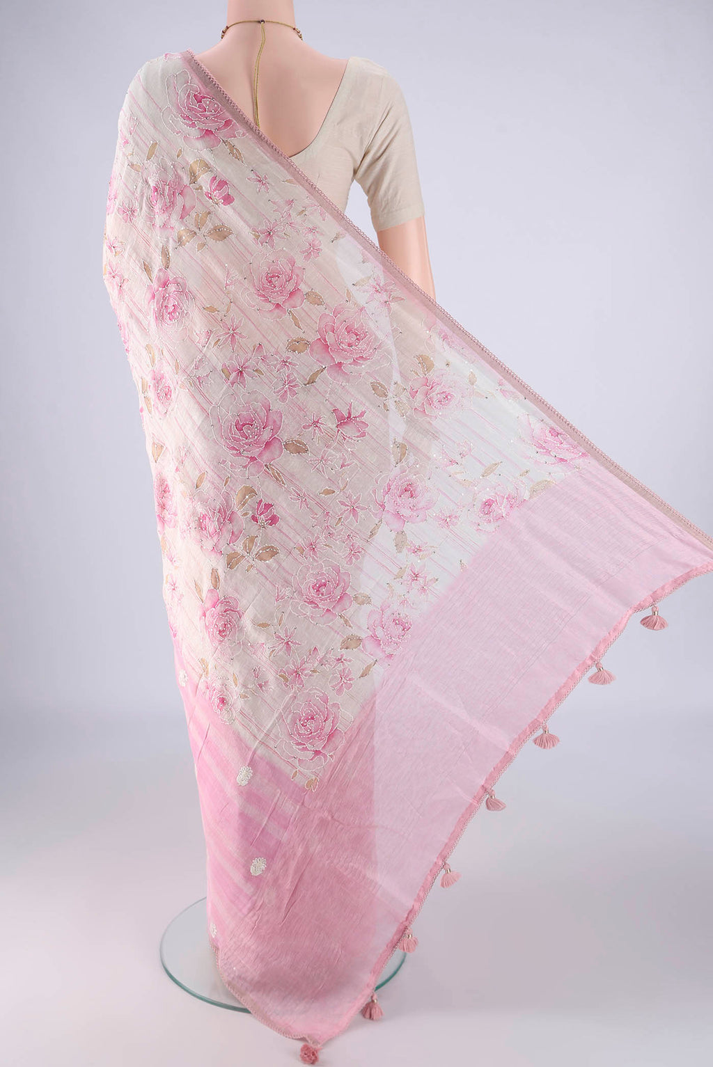 Flat view of Rose pink Linen Saree with Embroidery on the body and Thin Zari Line. 