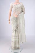 Off White Linen Saree with Embroidery on the body and Thin Zari Line.  displayed on a mannequin