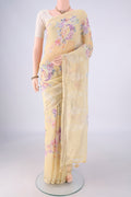 Yellow Linen Saree with Floral Print on the body and Zari Border.  displayed on a mannequin