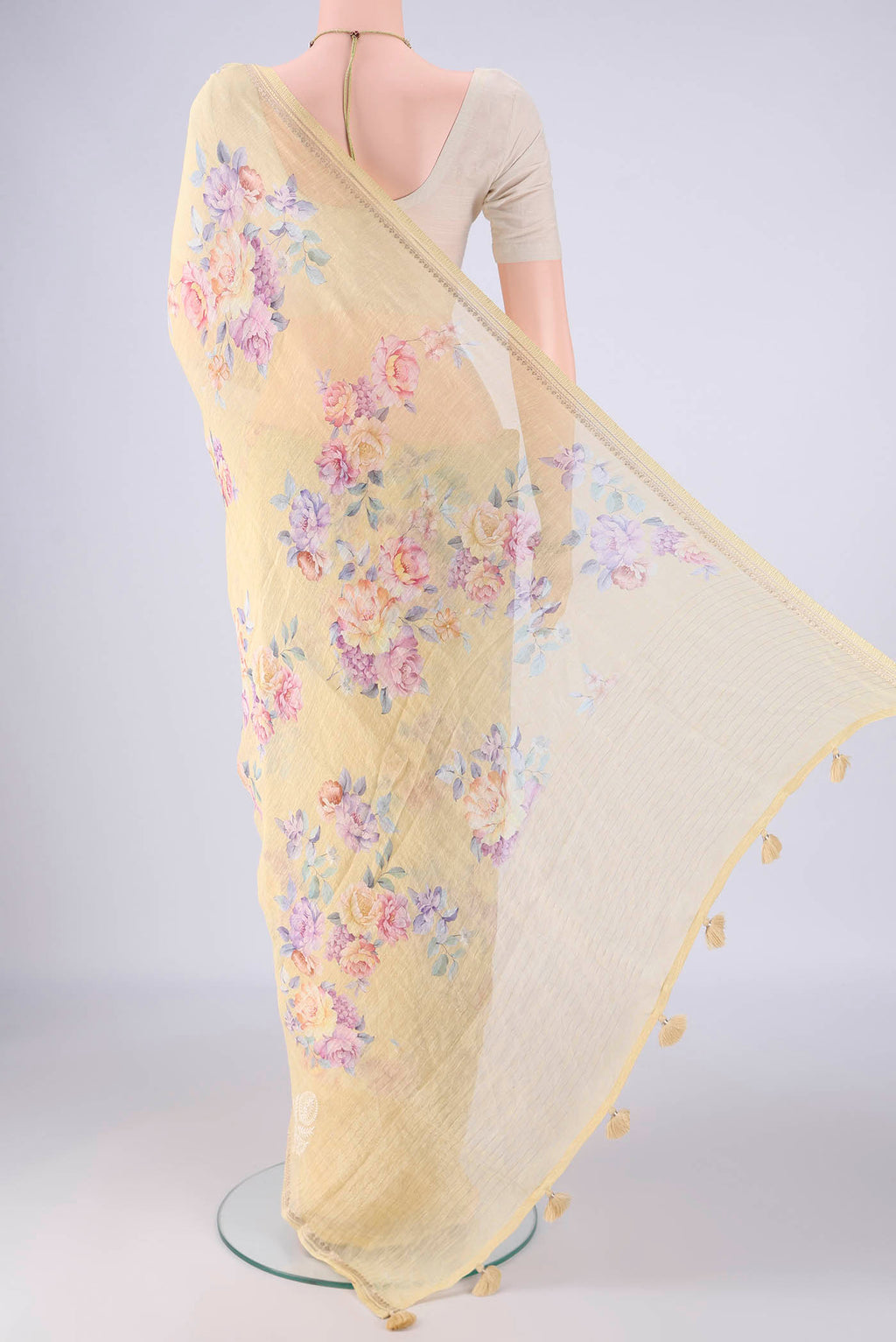 Flat view of Yellow Linen Saree with Floral Print on the body and Zari Border. 
