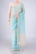 Sky Blue Linen Saree with Printed design on the body and Zari Border.  displayed on a mannequin