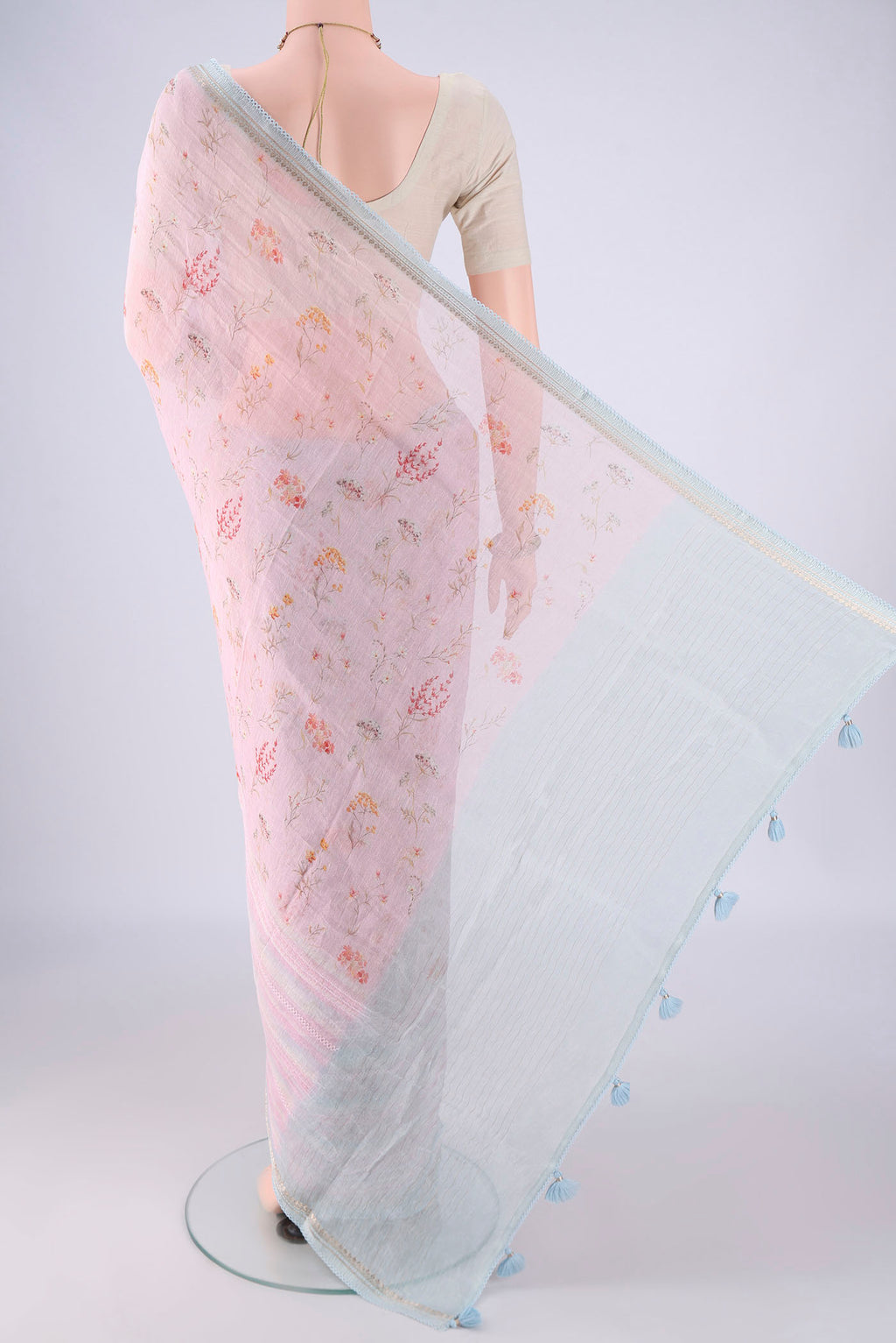 Flat view of Rose pink Linen Saree with Printed design on the body and Lace Border. 