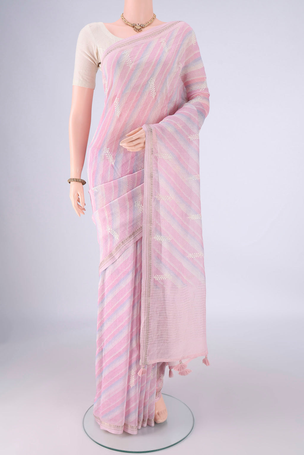 Multi Color Linen Saree with Lehariya on the body and Zari Border.  displayed on a mannequin