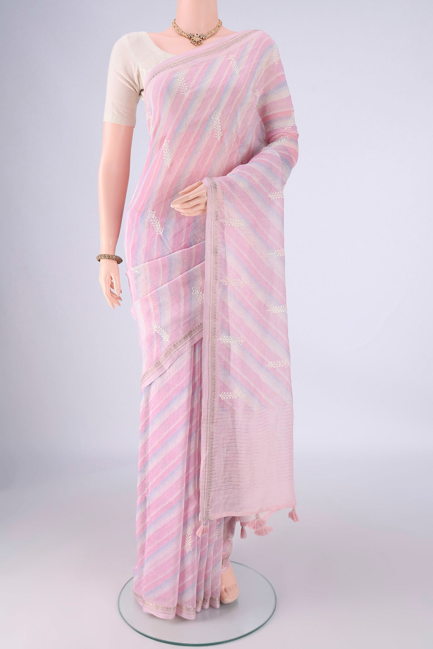 Multi Color Linen Saree with Lehariya on the body and Zari Border.  displayed on a mannequin