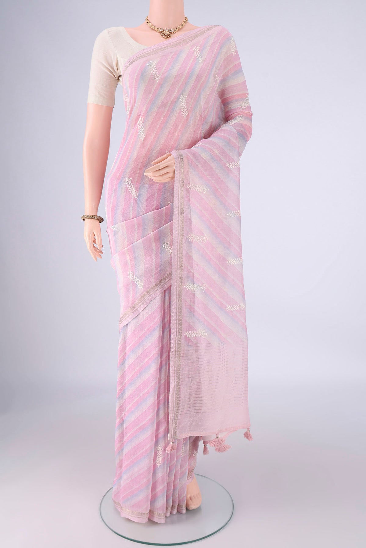 Multi Color Linen Saree with Lehariya on the body and Zari Border.  displayed on a mannequin