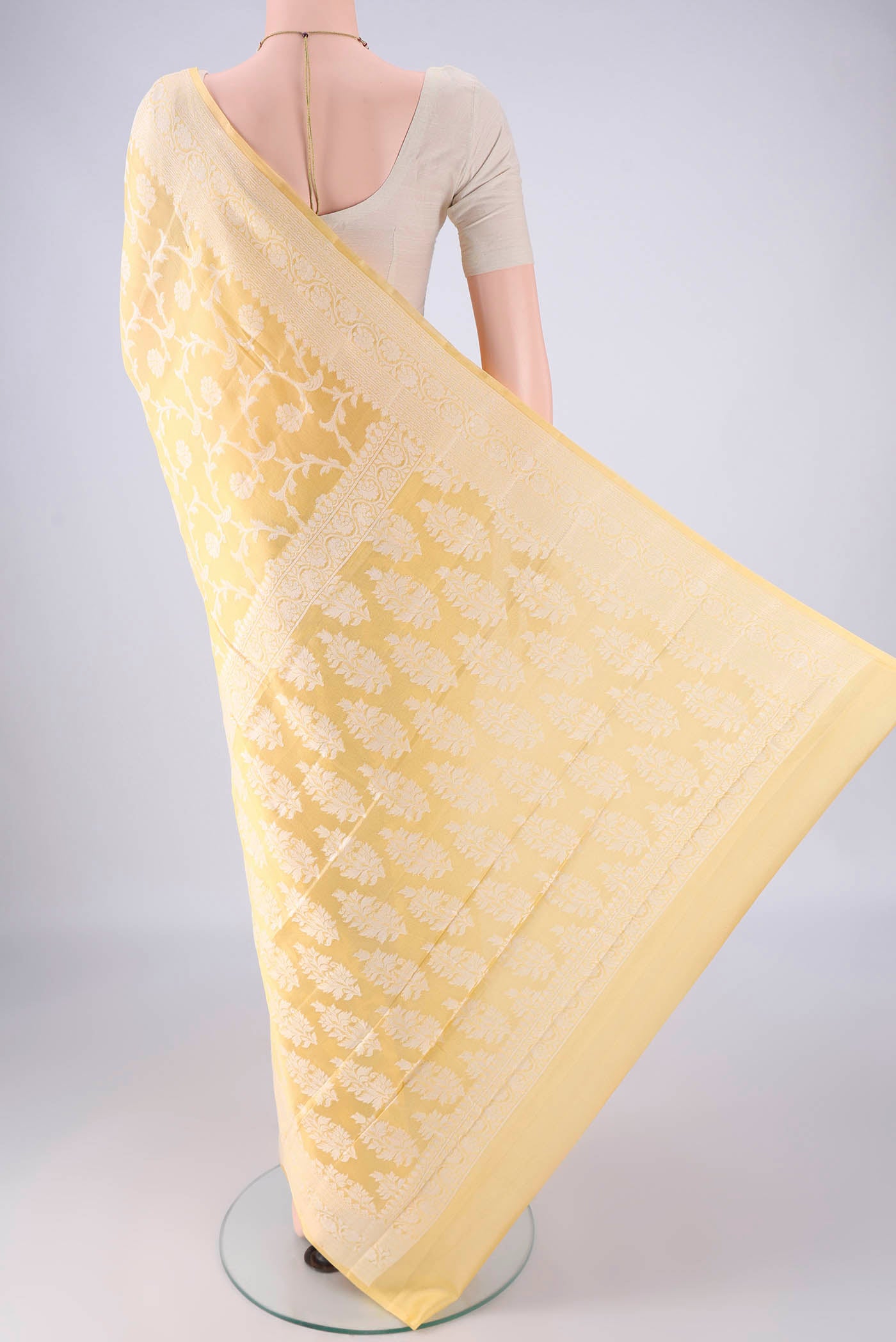 Flat view of Yellow Blended Banarasi Georgette Saree with Thread Brocade on the body and Thread Border. 