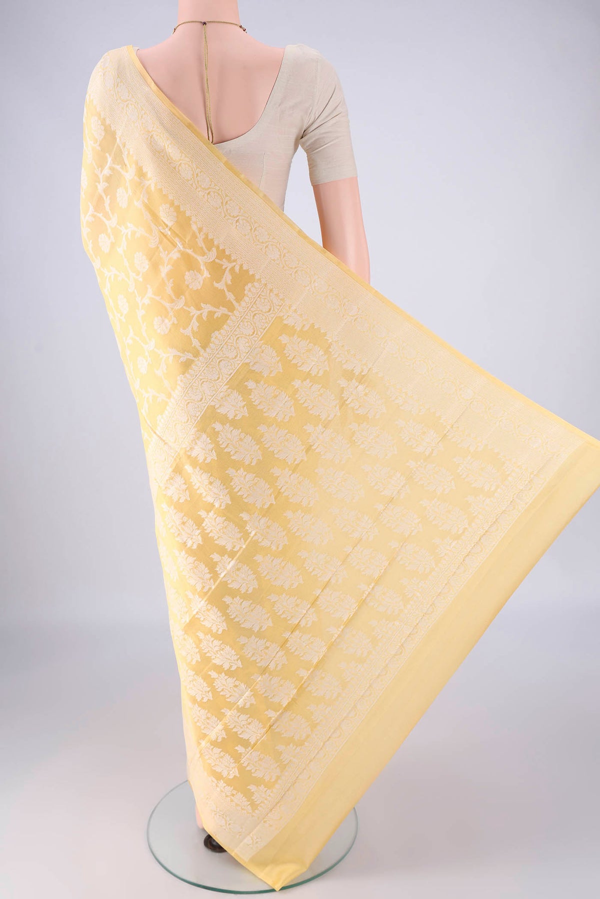 Flat view of Yellow Blended Banarasi Georgette Saree with Thread Brocade on the body and Thread Border. 
